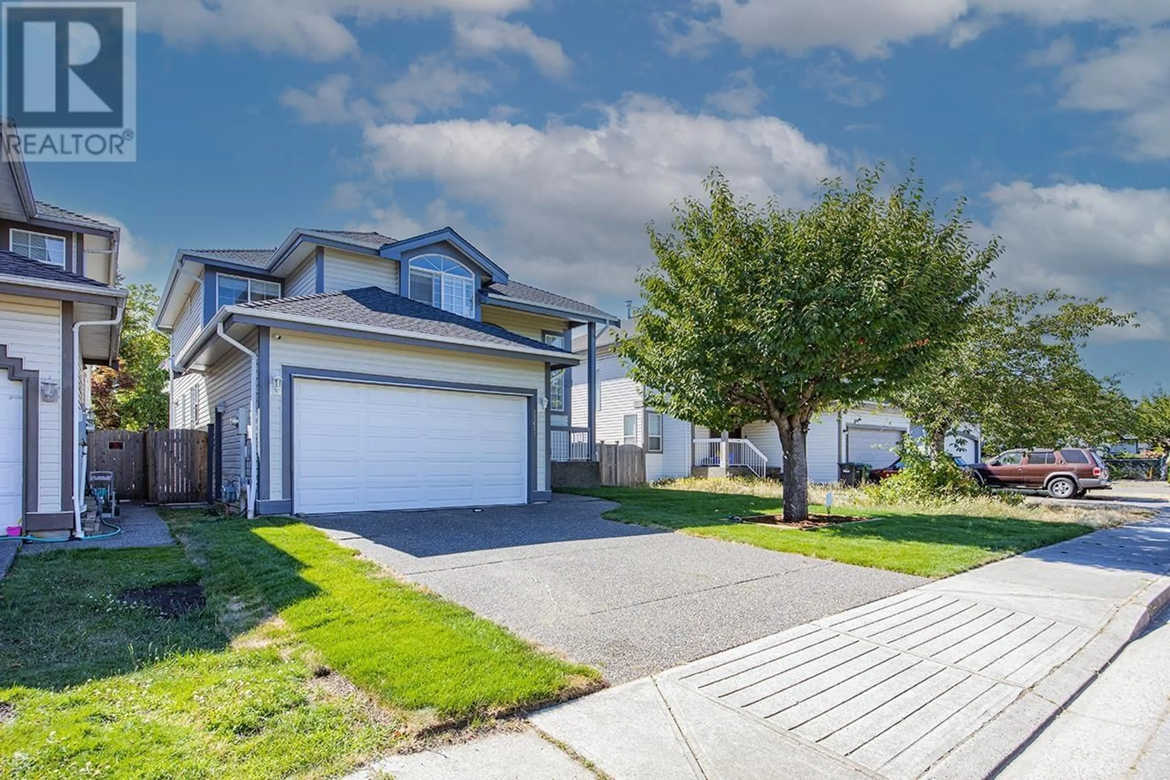 Home with vinyl exterior material, street for 22651 CHALDECOTT DRIVE, Richmond British Columbia V6V2T9