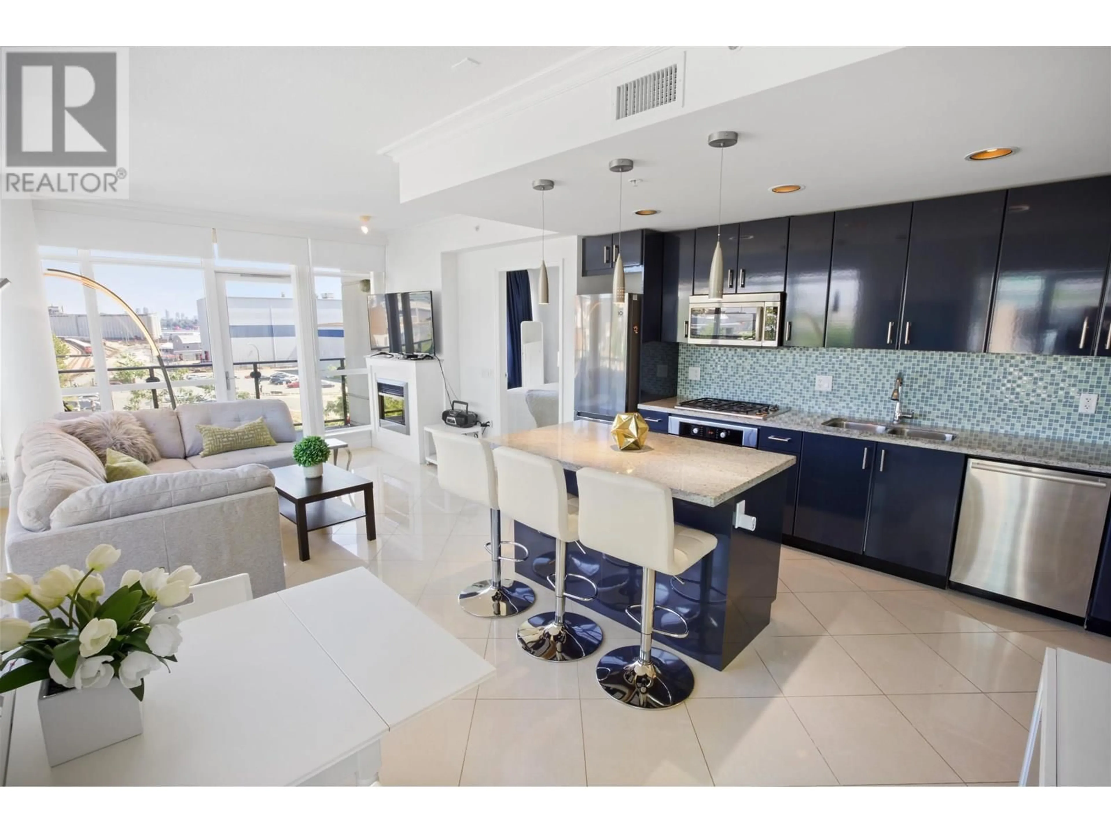 Open concept kitchen, ceramic/tile floor for 502 - 172 VICTORY SHIP WAY, North Vancouver British Columbia V7L0B5