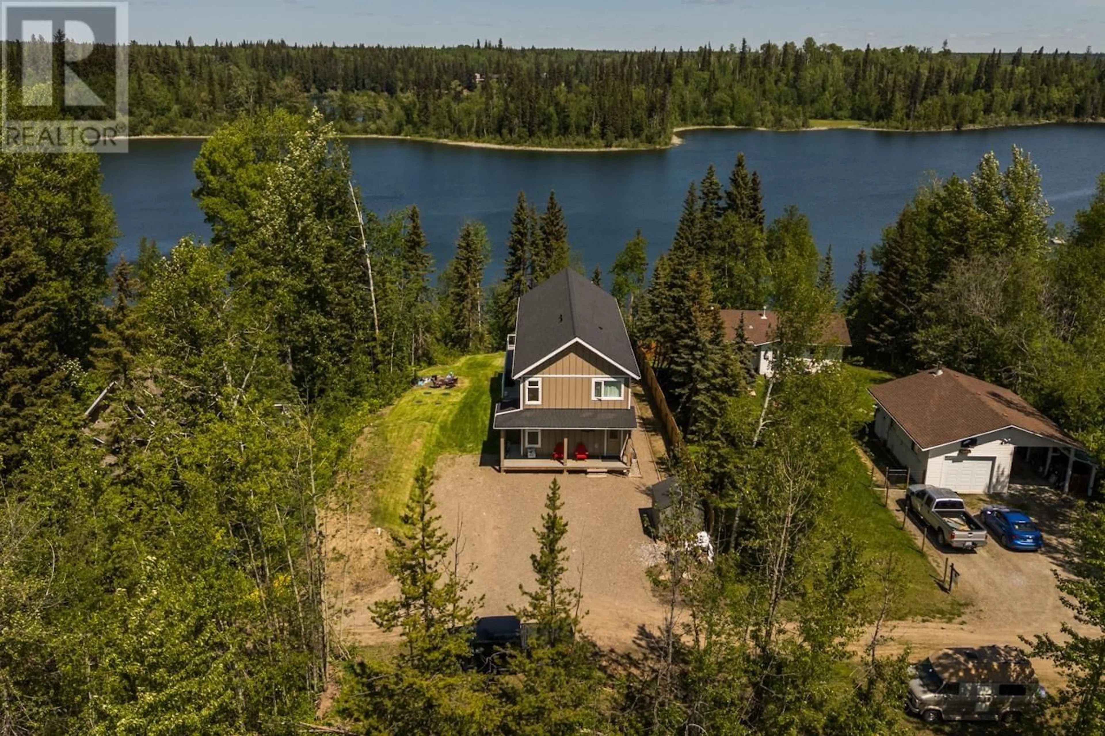 A pic from outside/outdoor area/front of a property/back of a property/a pic from drone, water/lake/river/ocean view for 28240 NESS LAKE ROAD, Prince George British Columbia V2K5N1