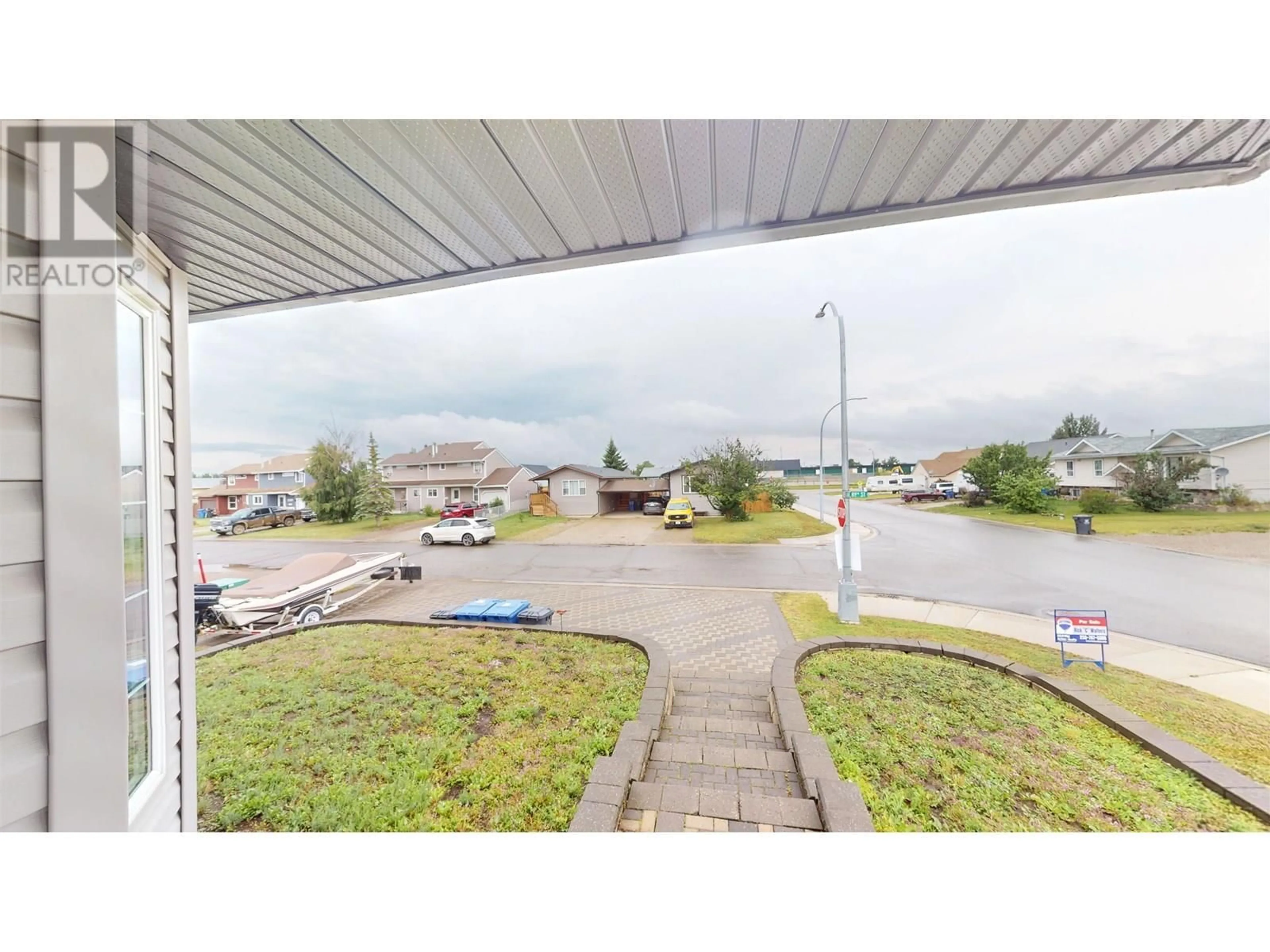 A pic from outside/outdoor area/front of a property/back of a property/a pic from drone, street for 10711 89 STREET, Fort St. John British Columbia V1J5S8