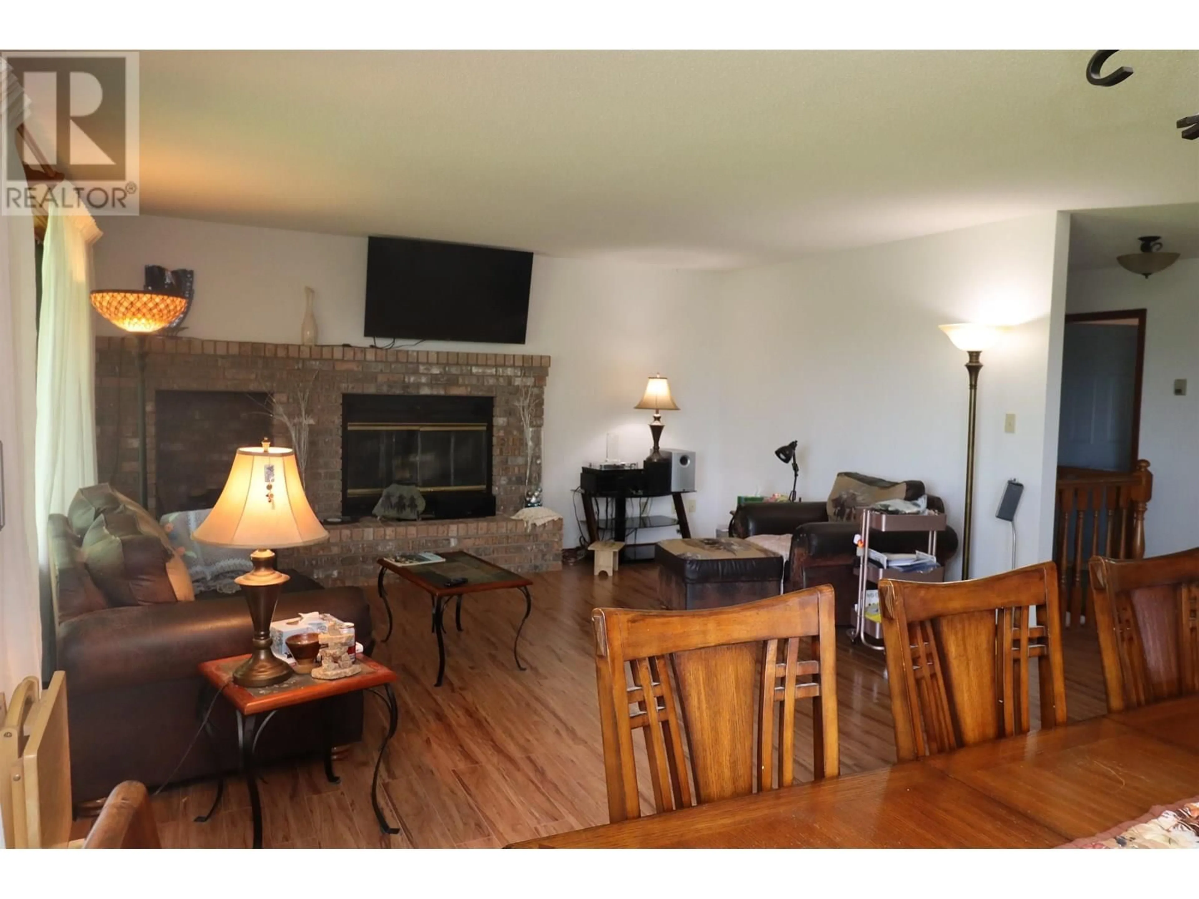 Living room with furniture, wood/laminate floor for 9133 INGLEWOOD ROAD, Prince George British Columbia V2K5H6