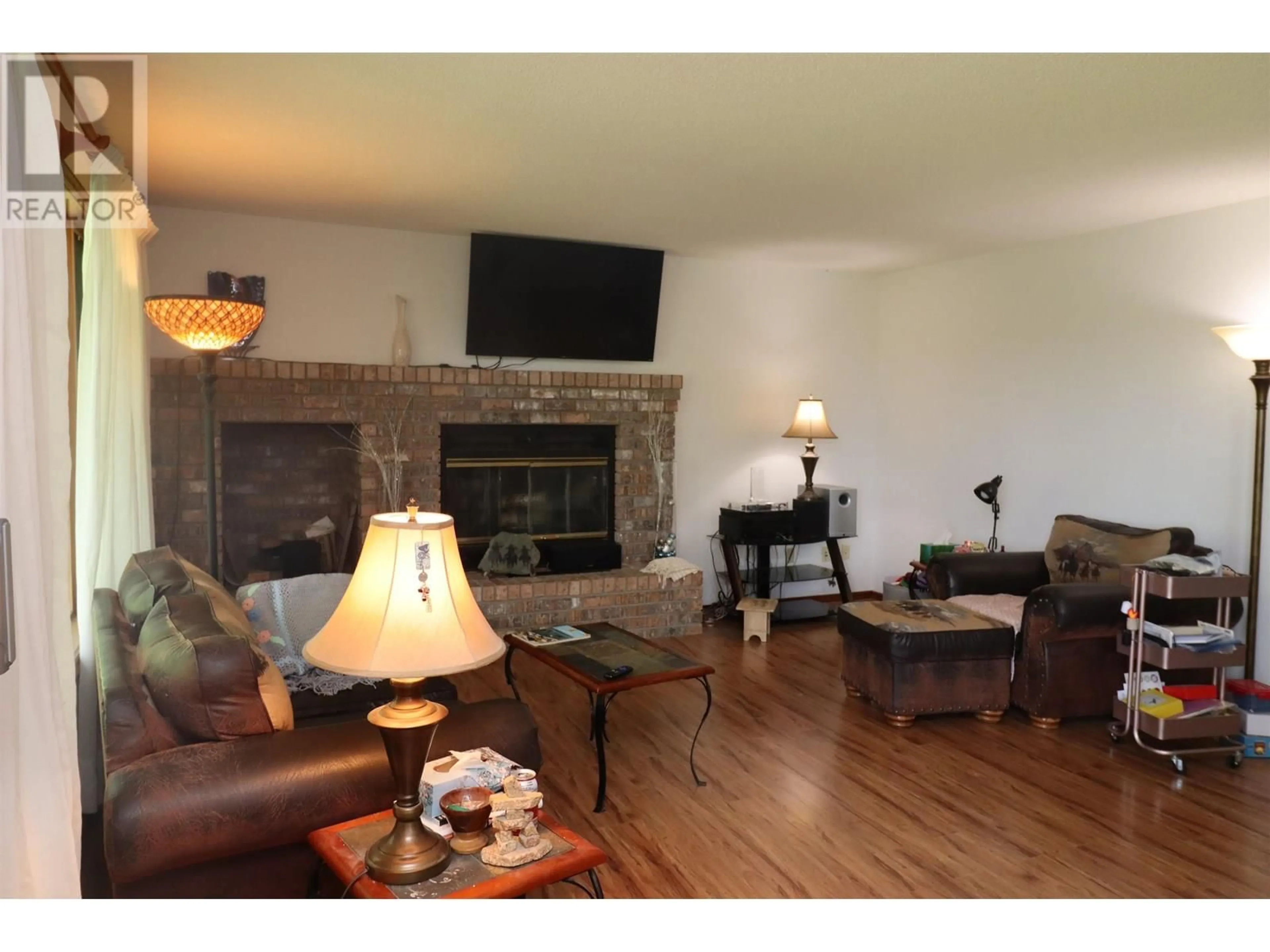 Living room with furniture, wood/laminate floor for 9133 INGLEWOOD ROAD, Prince George British Columbia V2K5H6