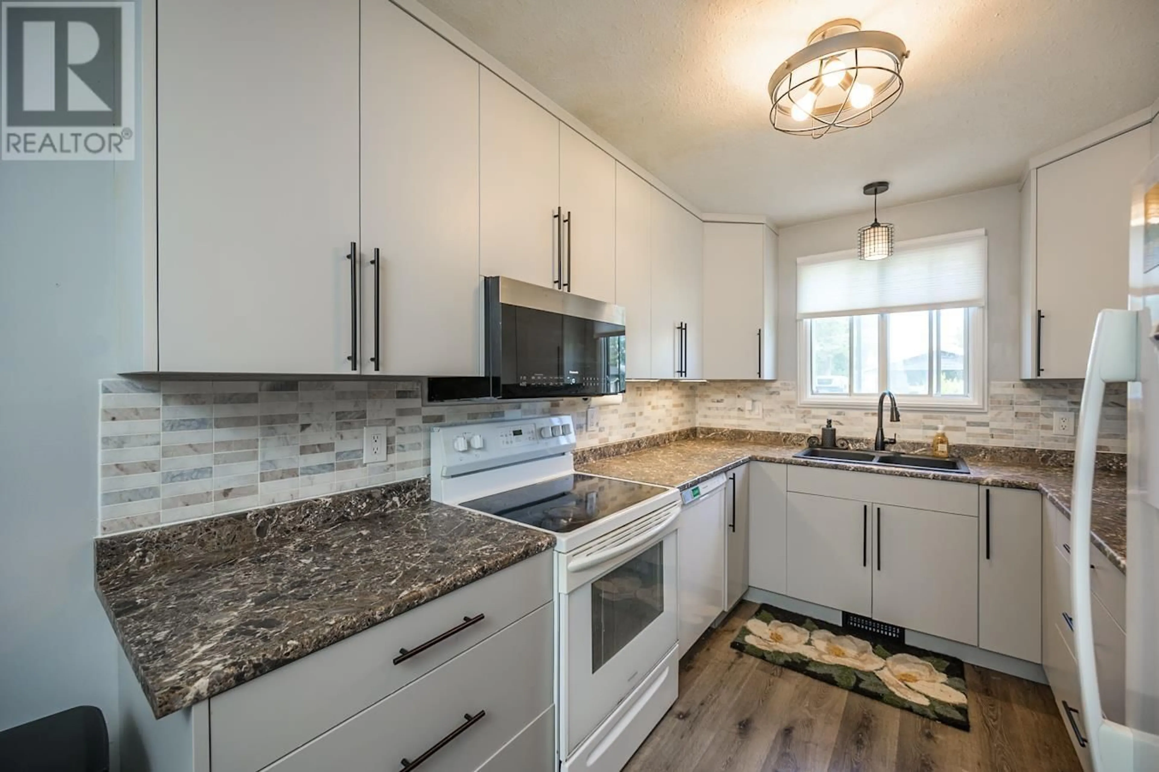 Open concept kitchen, ceramic/tile floor for 7788 NEWTON CRESCENT, Prince George British Columbia V2N3L6