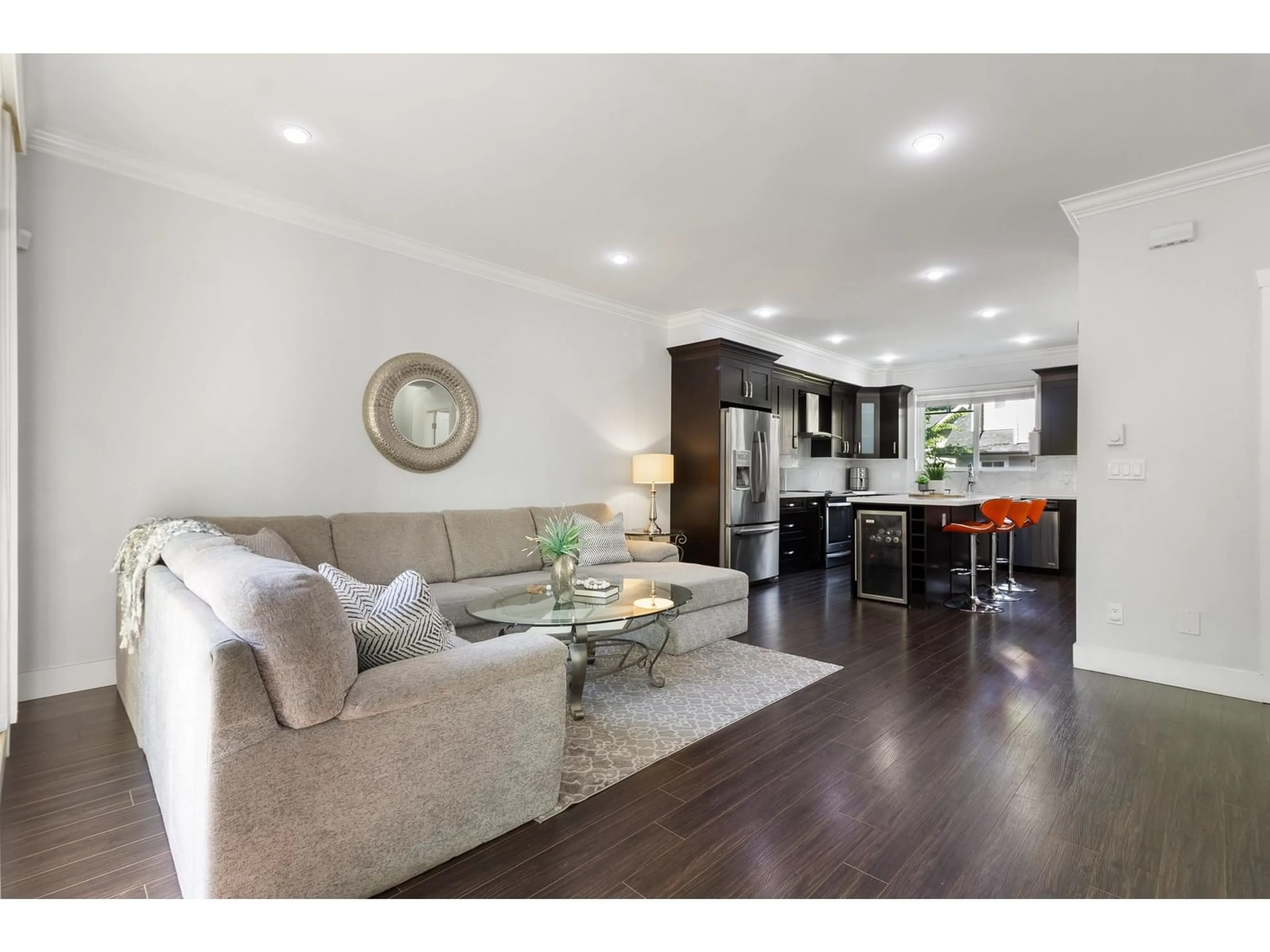 Living room with furniture, wood/laminate floor for 10 - 14285 64, Surrey British Columbia V3W1Z2