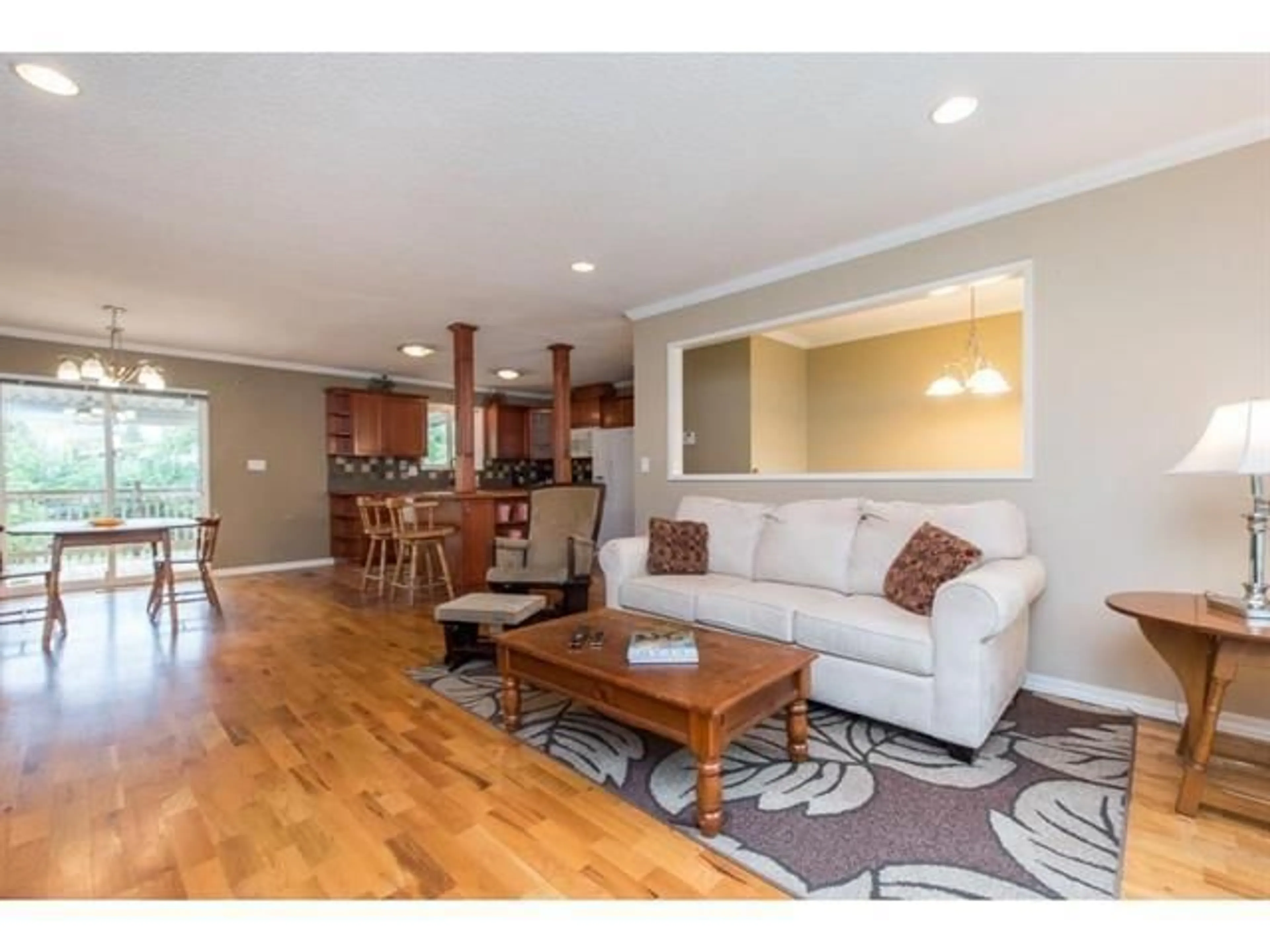 Living room with furniture, wood/laminate floor for 4815 201, Langley British Columbia V3A5V6