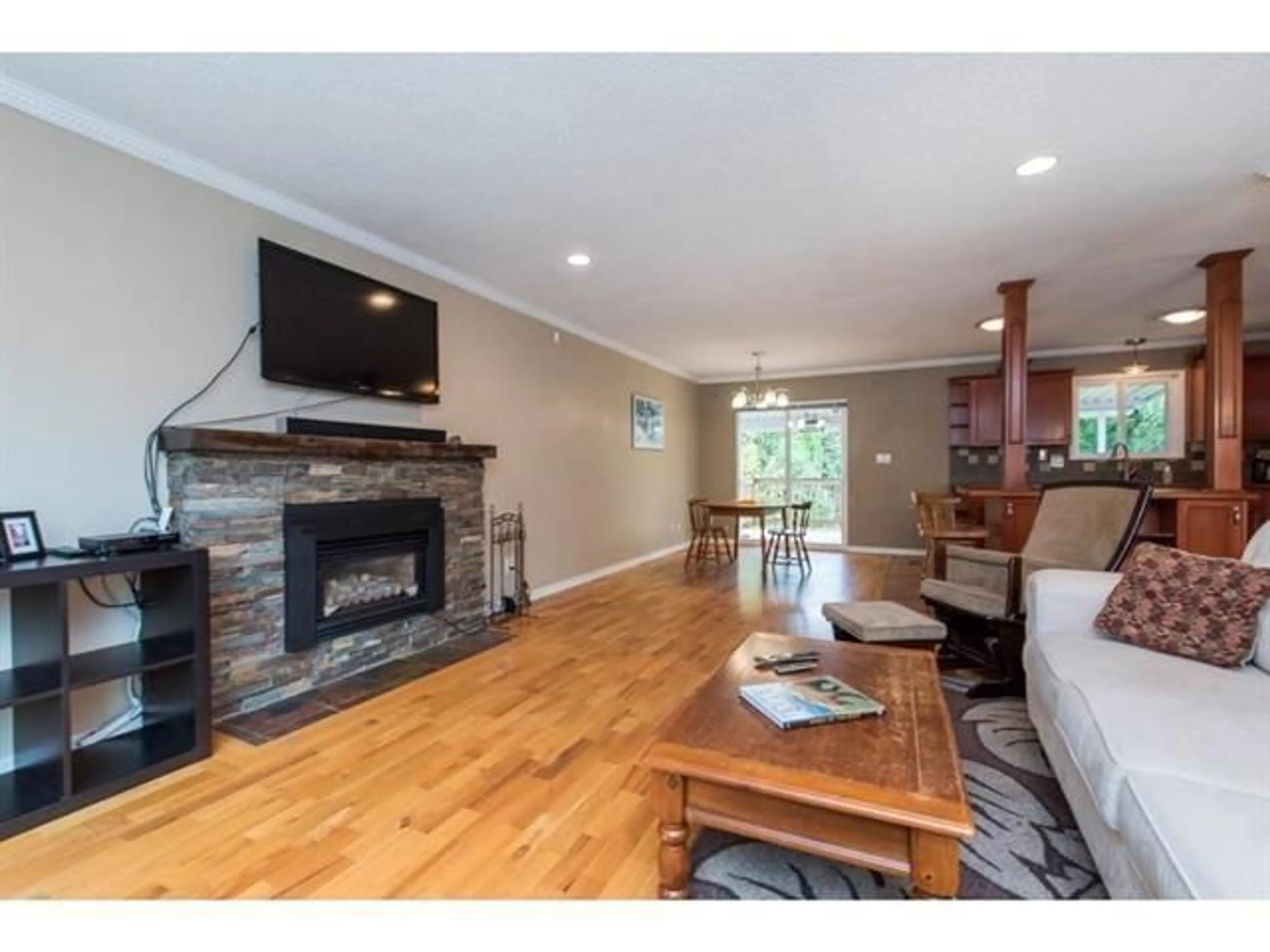 Living room with furniture, wood/laminate floor for 4815 201, Langley British Columbia V3A5V6