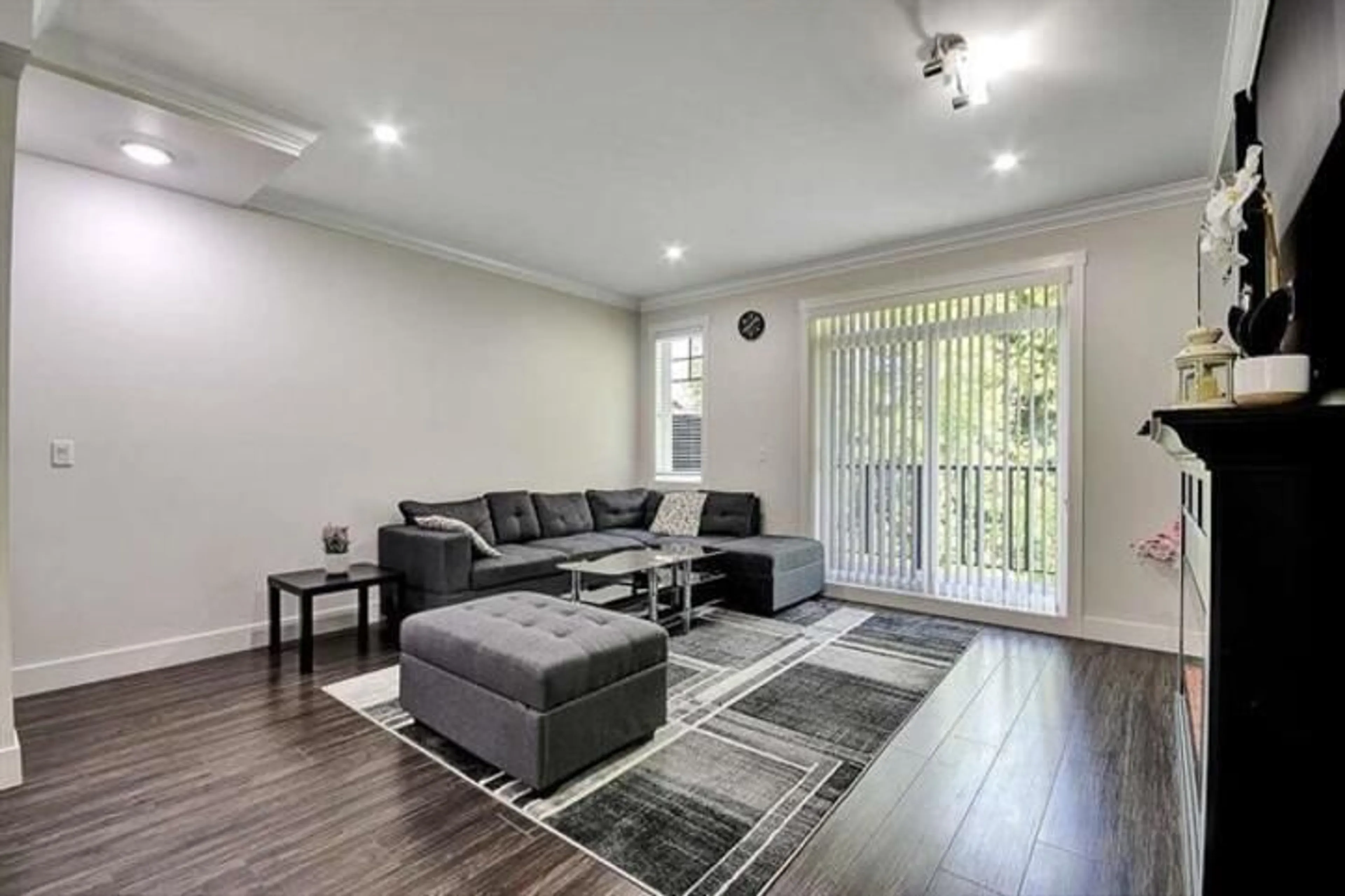 Living room with furniture, wood/laminate floor for 128 - 13898 64, Surrey British Columbia V3W1L6