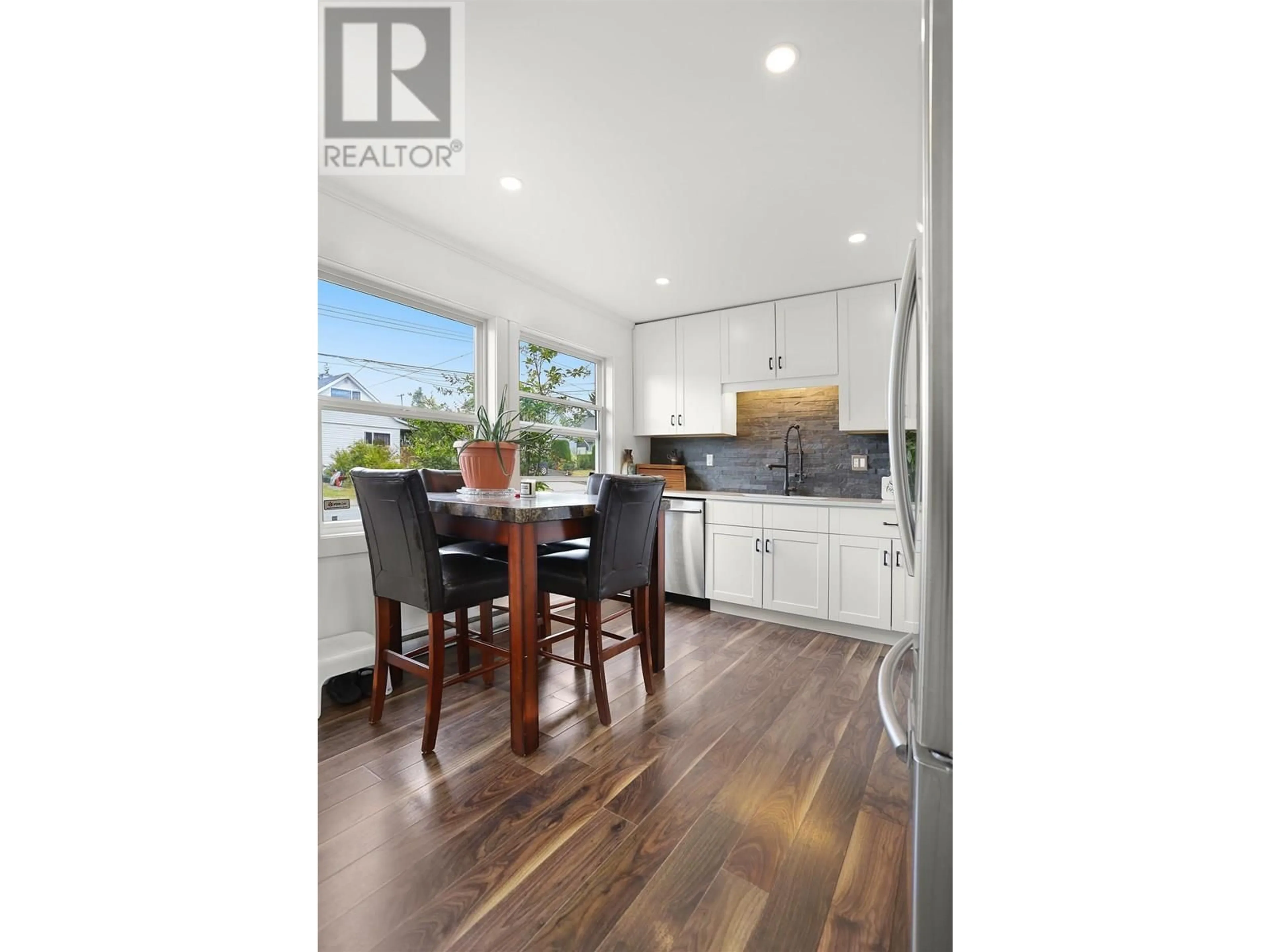 Open concept kitchen, wood/laminate floor for 48 FINCH STREET, Kitimat British Columbia V8C1T2