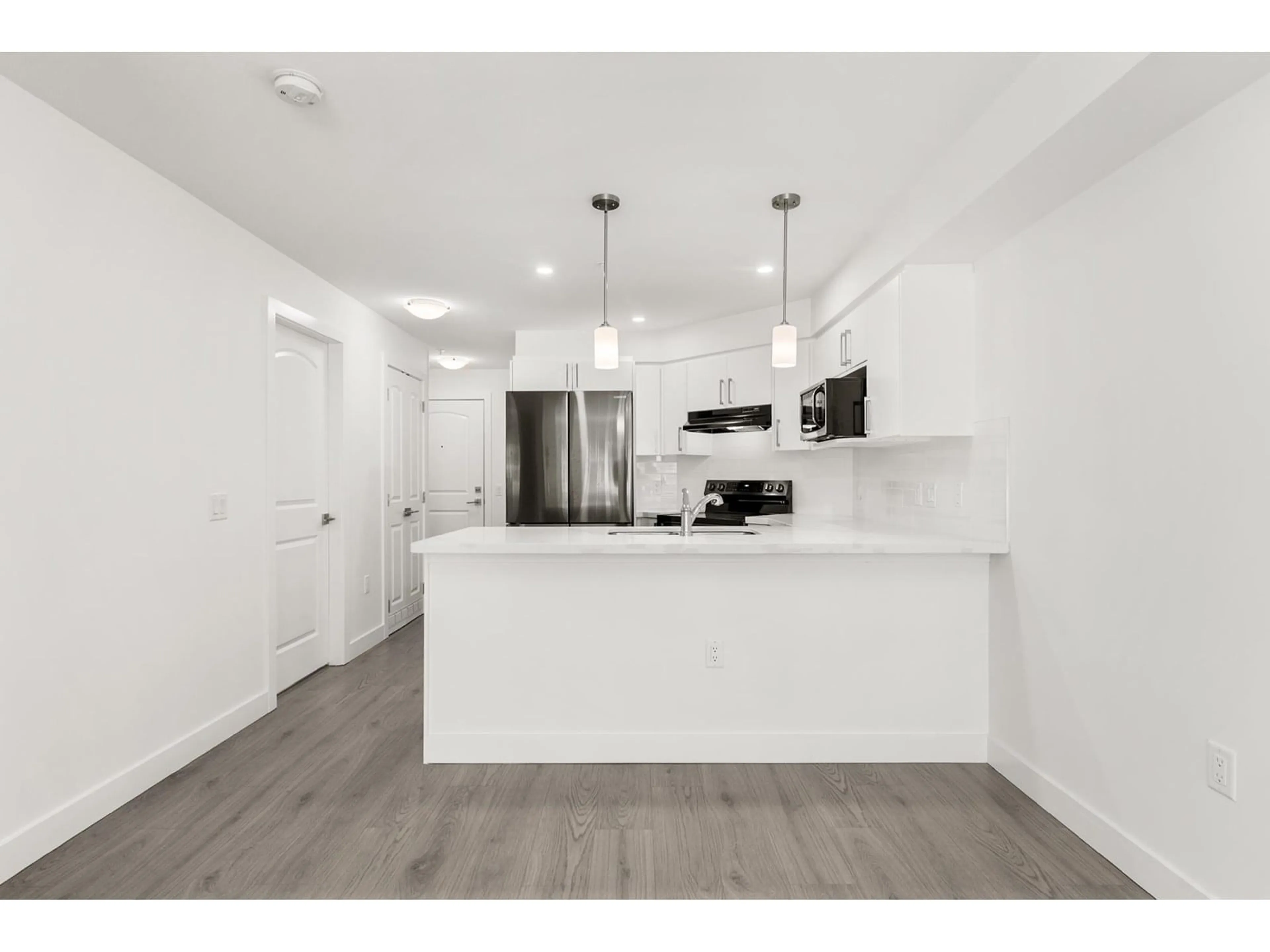 Open concept kitchen, unknown for 110 - 19730 56, Langley British Columbia V3A3X6