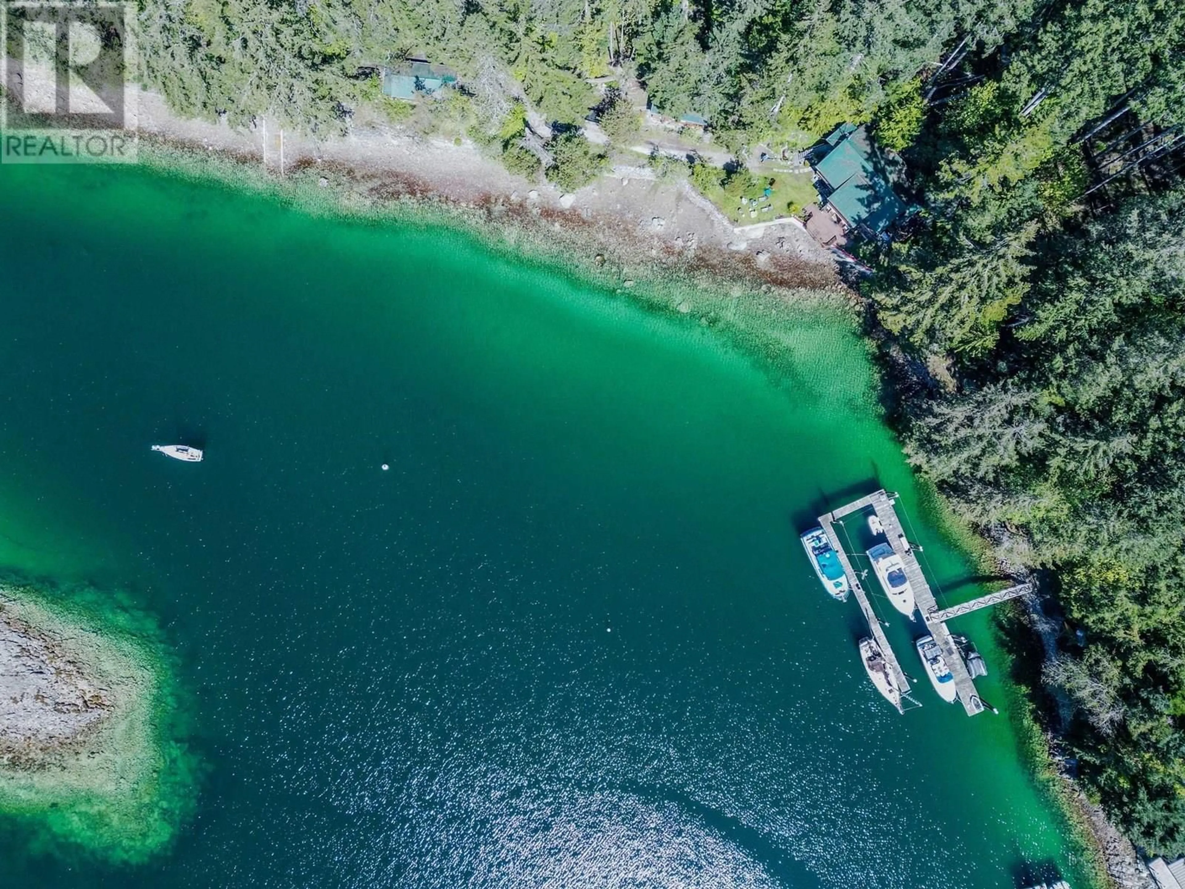 A pic from outside/outdoor area/front of a property/back of a property/a pic from drone, water/lake/river/ocean view for 5446 SECRET COVE ROAD, Halfmoon Bay British Columbia V7Z1B7
