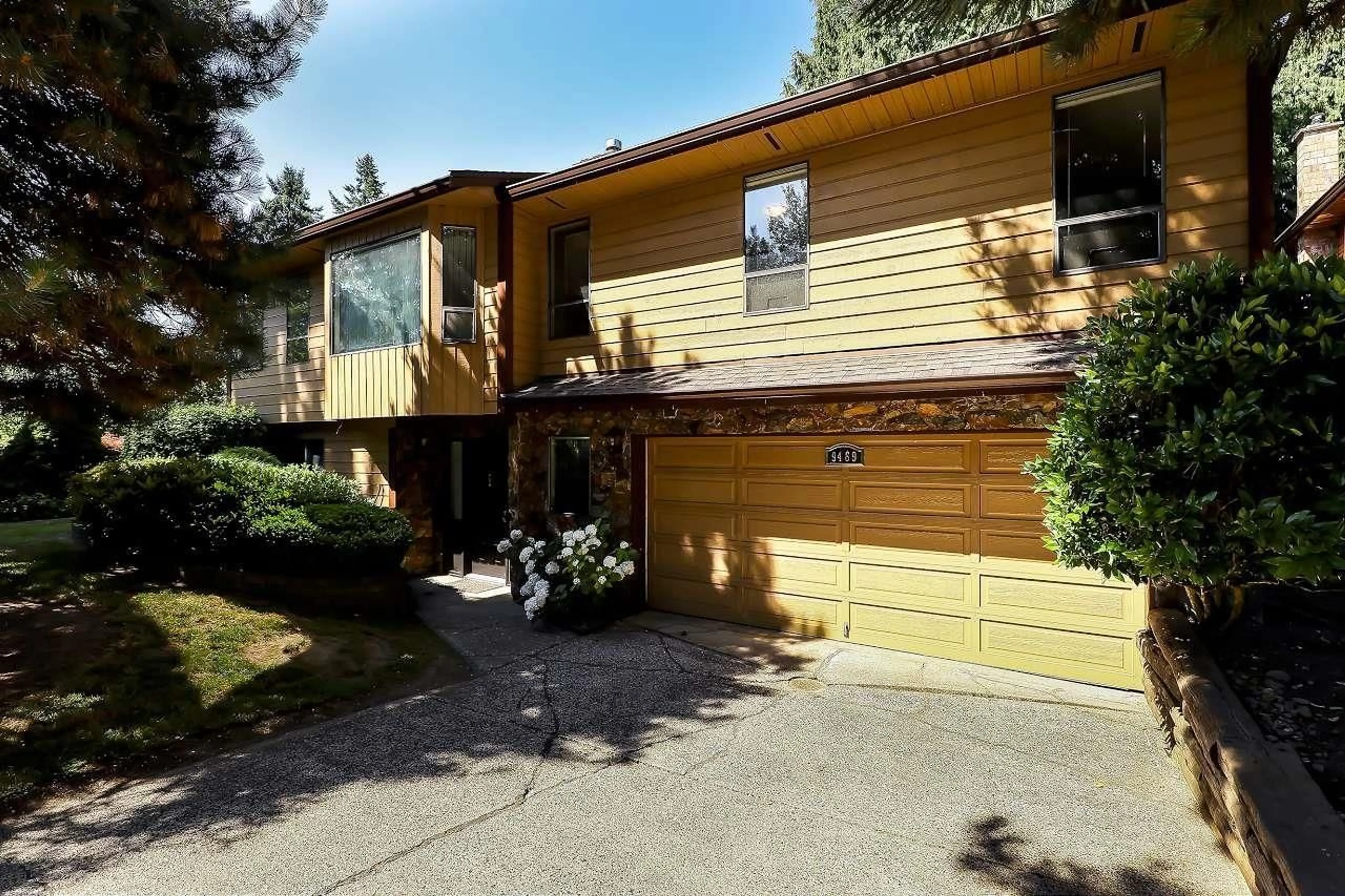 Home with vinyl exterior material, street for 9469 148A, Surrey British Columbia V3R8E2