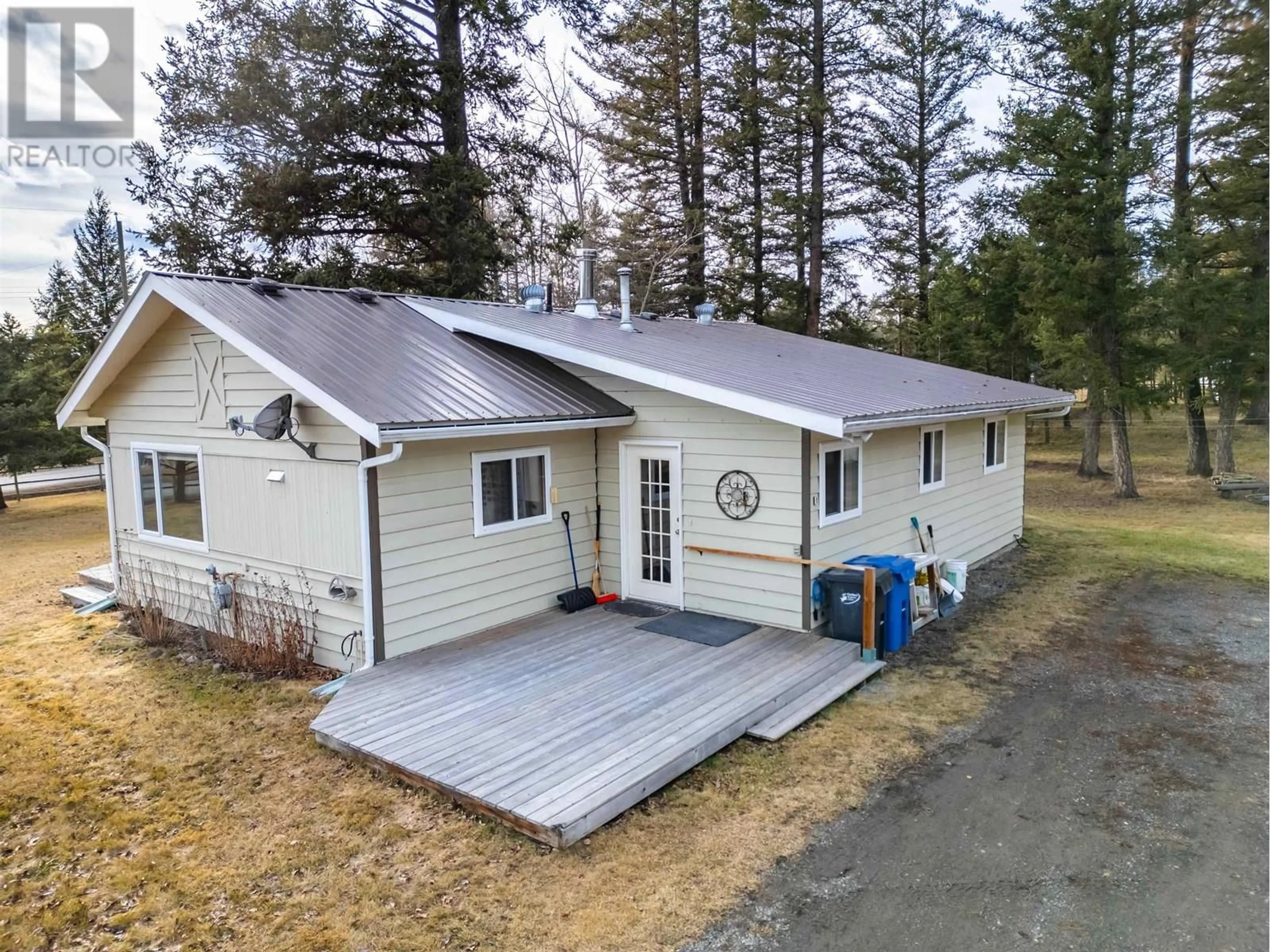 A pic from outside/outdoor area/front of a property/back of a property/a pic from drone, unknown for 4734 KITWANGA DRIVE, 108 Mile Ranch British Columbia V0K2Z0