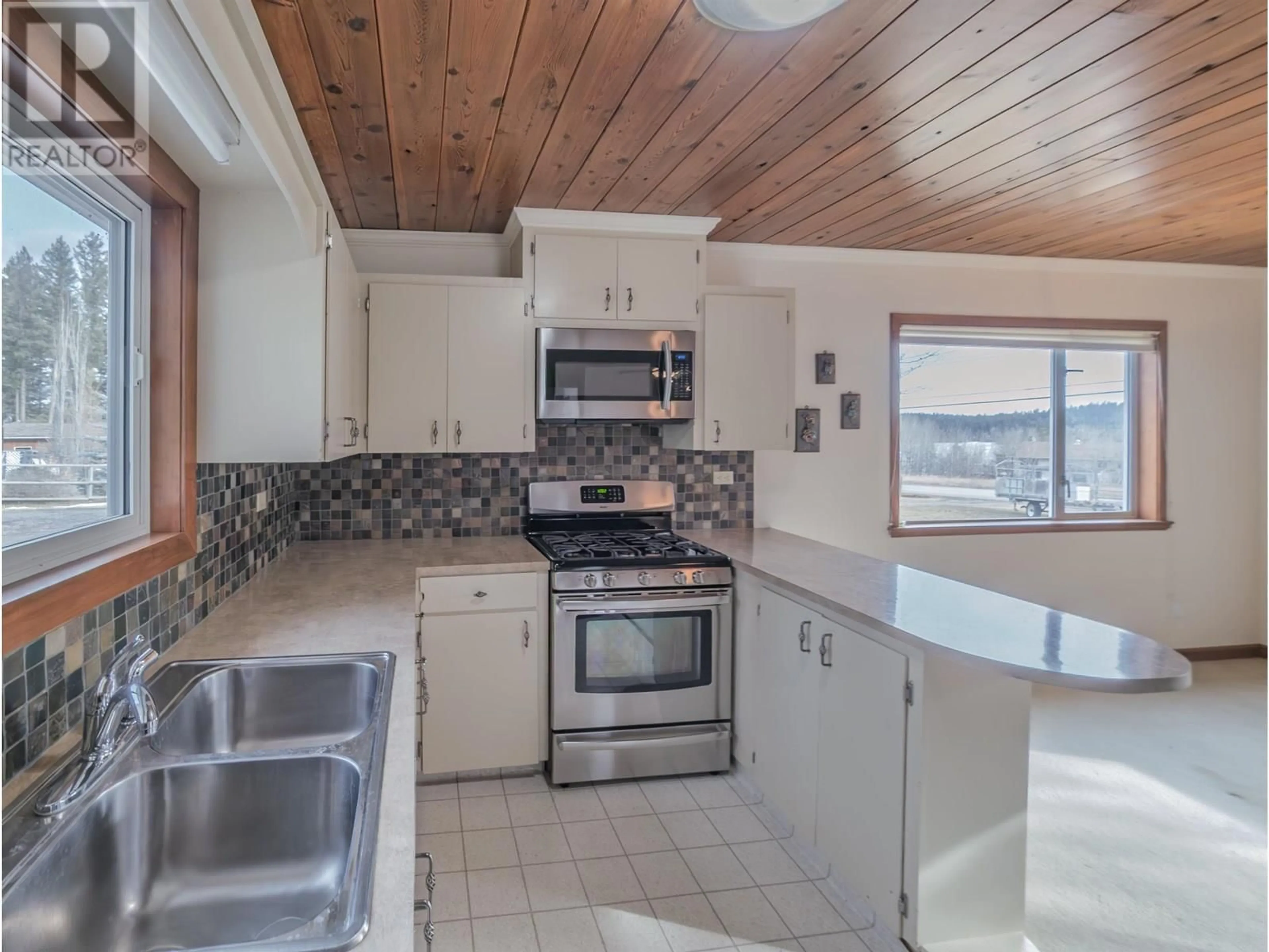 Open concept kitchen, unknown for 4734 KITWANGA DRIVE, 108 Mile Ranch British Columbia V0K2Z0