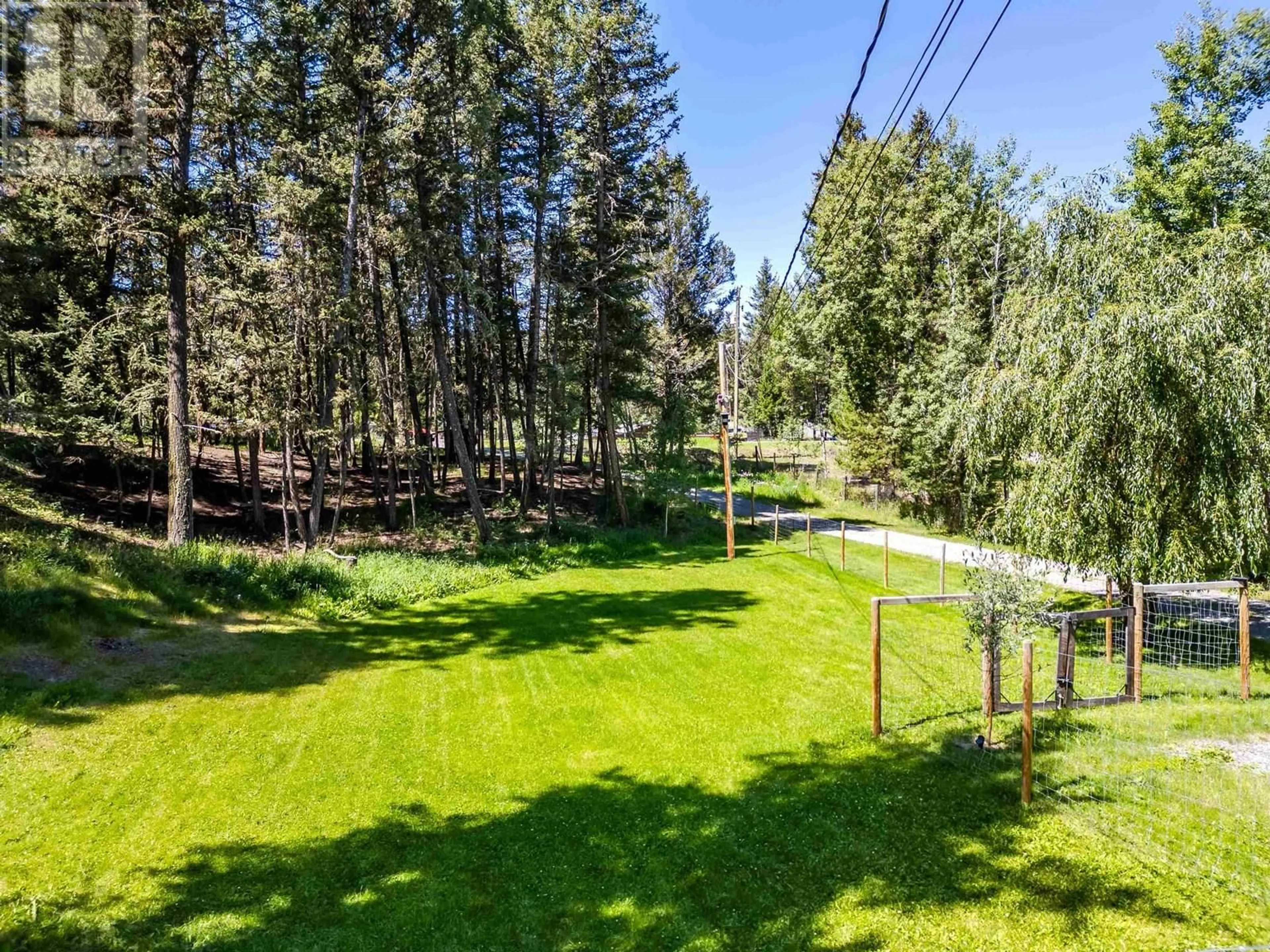 A pic from outside/outdoor area/front of a property/back of a property/a pic from drone, forest/trees view for 4911 PEASIM COURT, 108 Mile Ranch British Columbia V0K2Z0