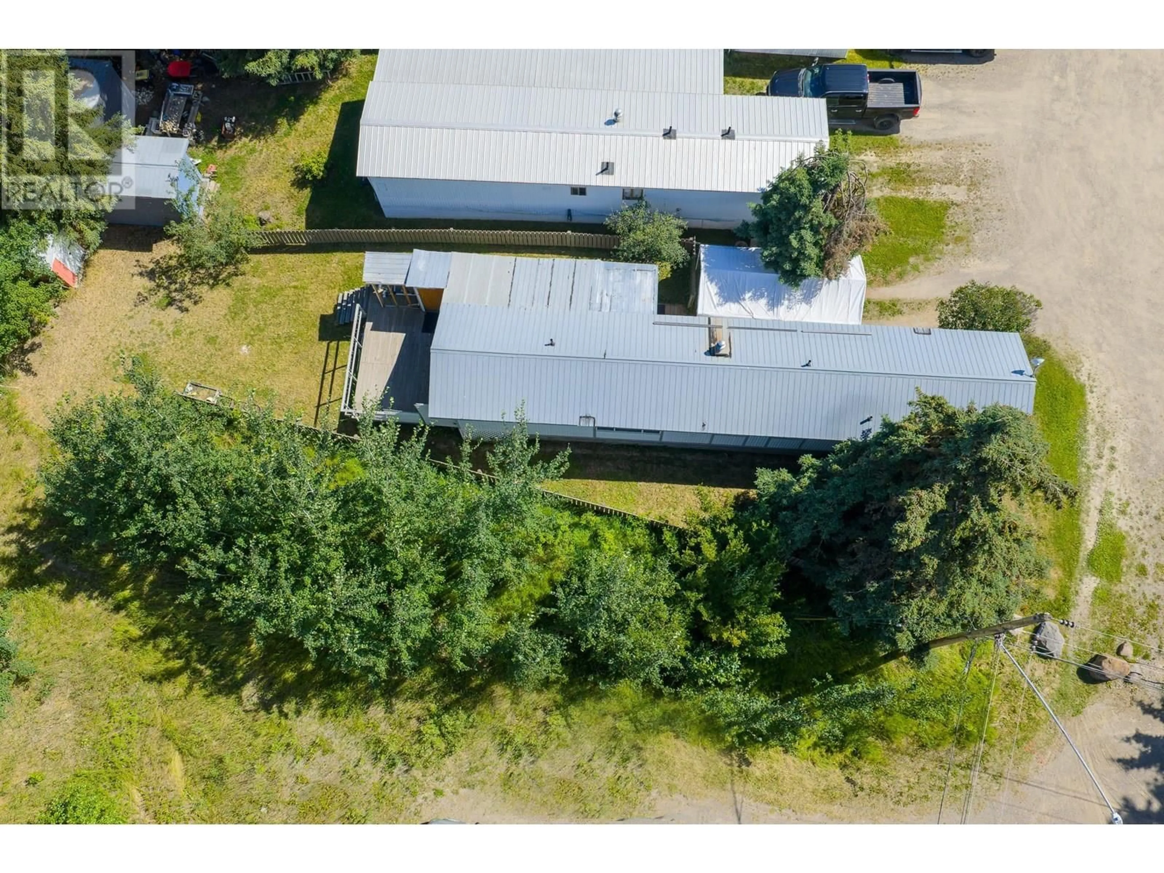A pic from outside/outdoor area/front of a property/back of a property/a pic from drone, building for 7 - 2091 16 HIGHWAY, Vanderhoof British Columbia V0J3A0