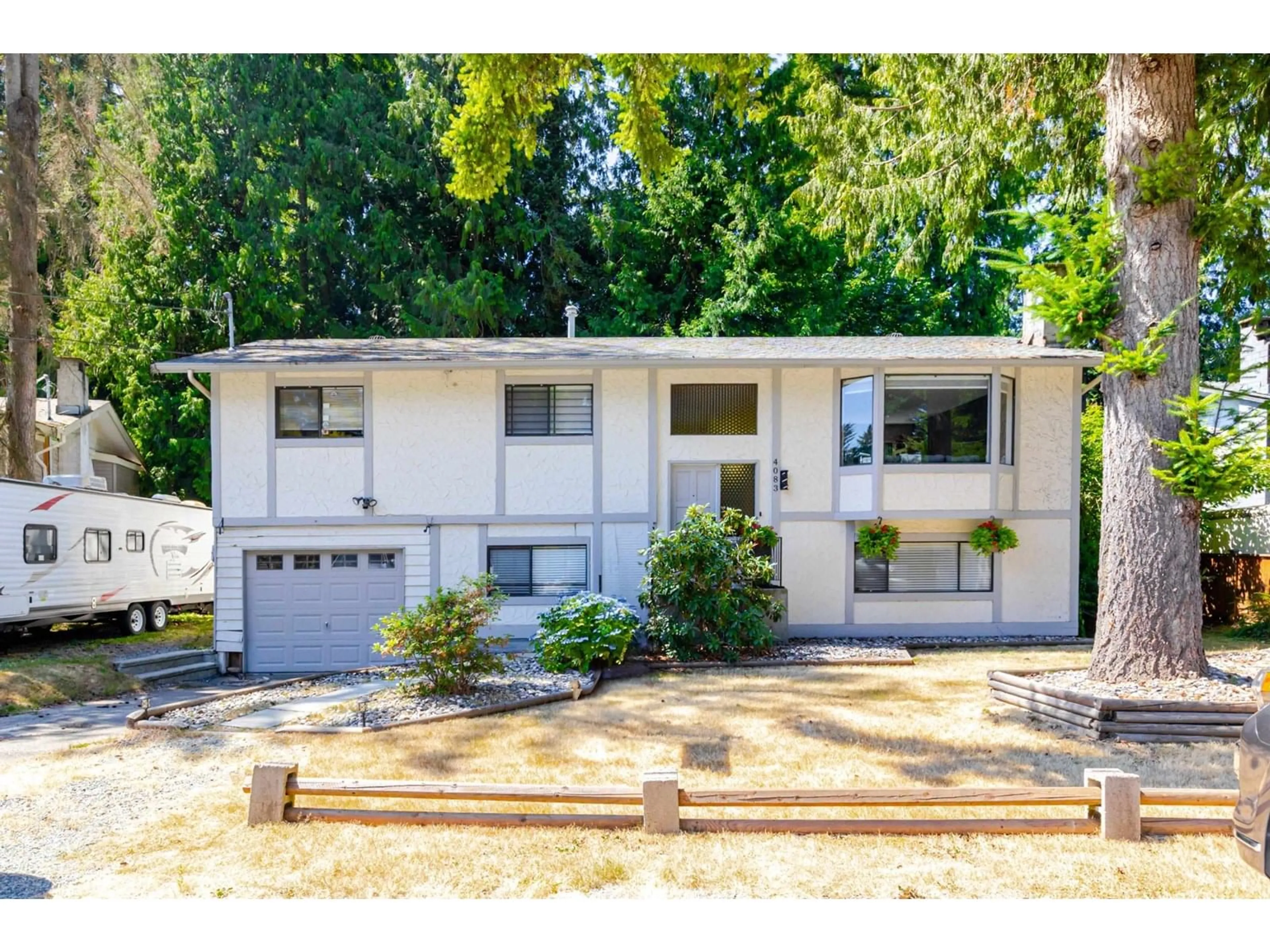 Home with vinyl exterior material, street for 4083 206A, Langley British Columbia V3A4Z7