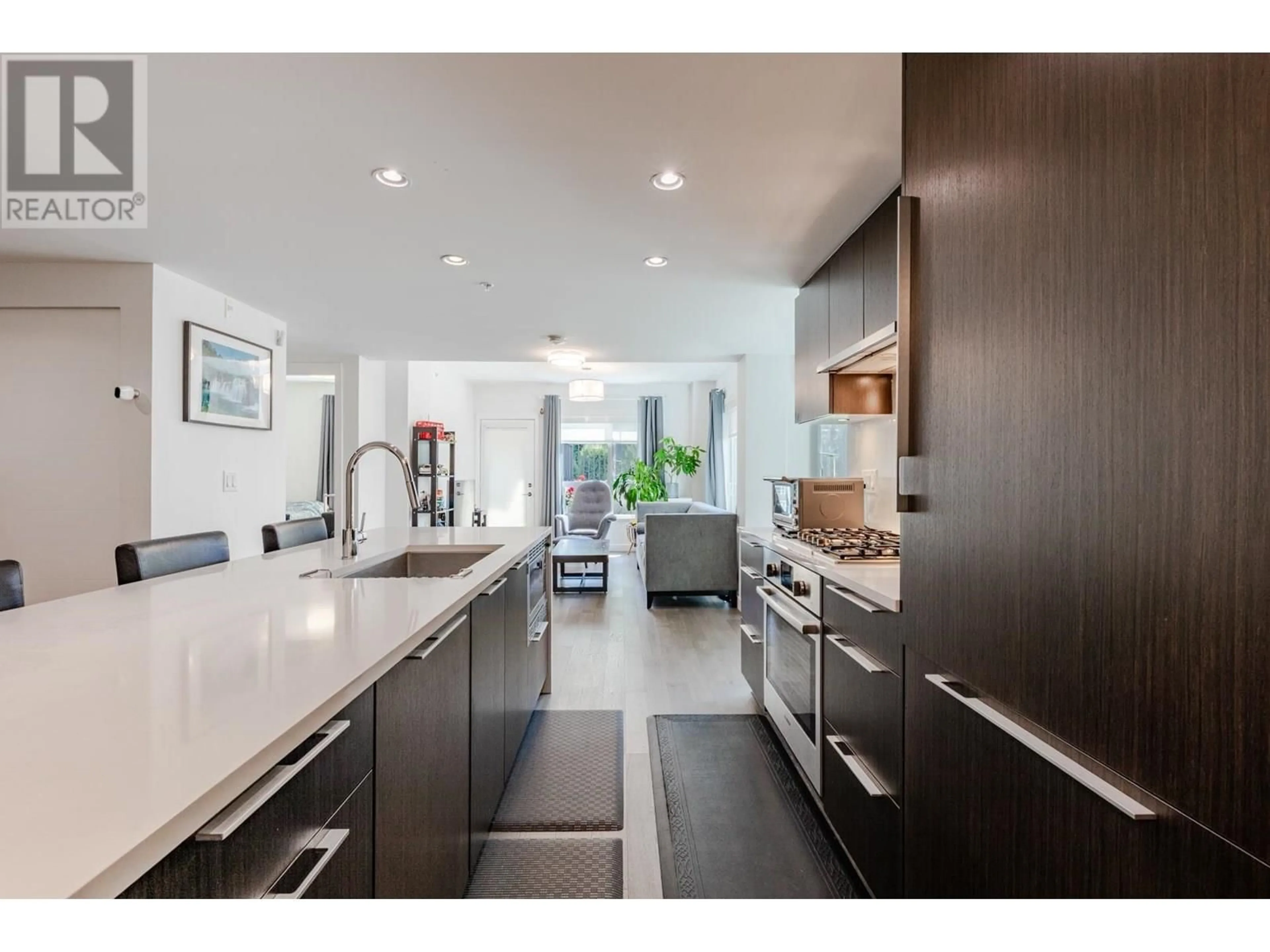 Open concept kitchen, ceramic/tile floor for 104 - 7828 GRANVILLE STREET, Vancouver British Columbia V6P4Z2