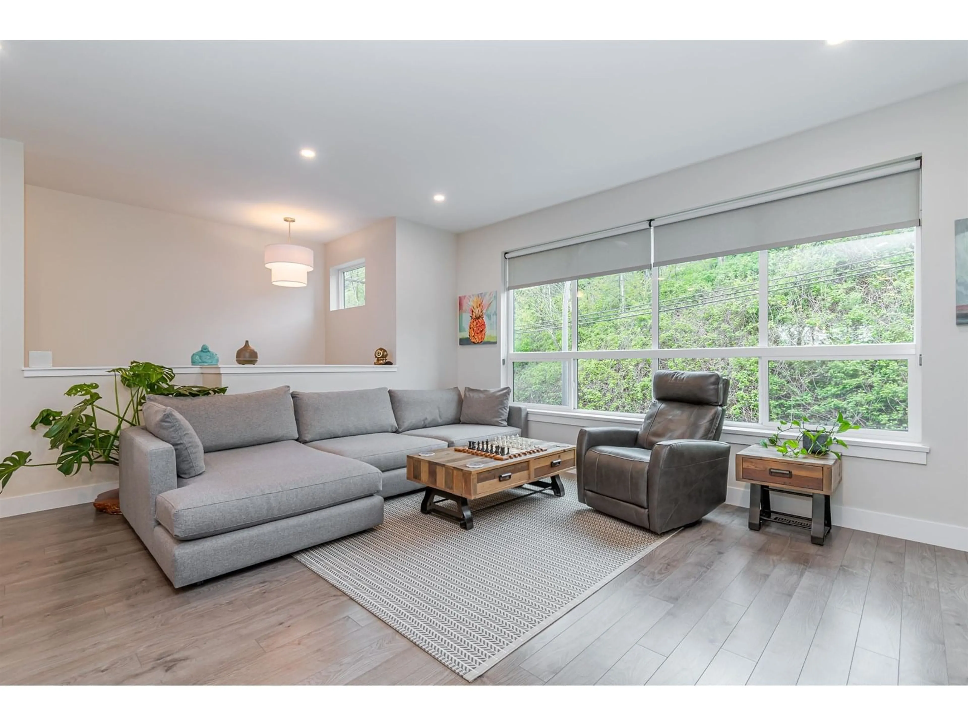 Living room with furniture, wood/laminate floor for 10 - 36130 WATERLEAF, Abbotsford British Columbia V3G0G5