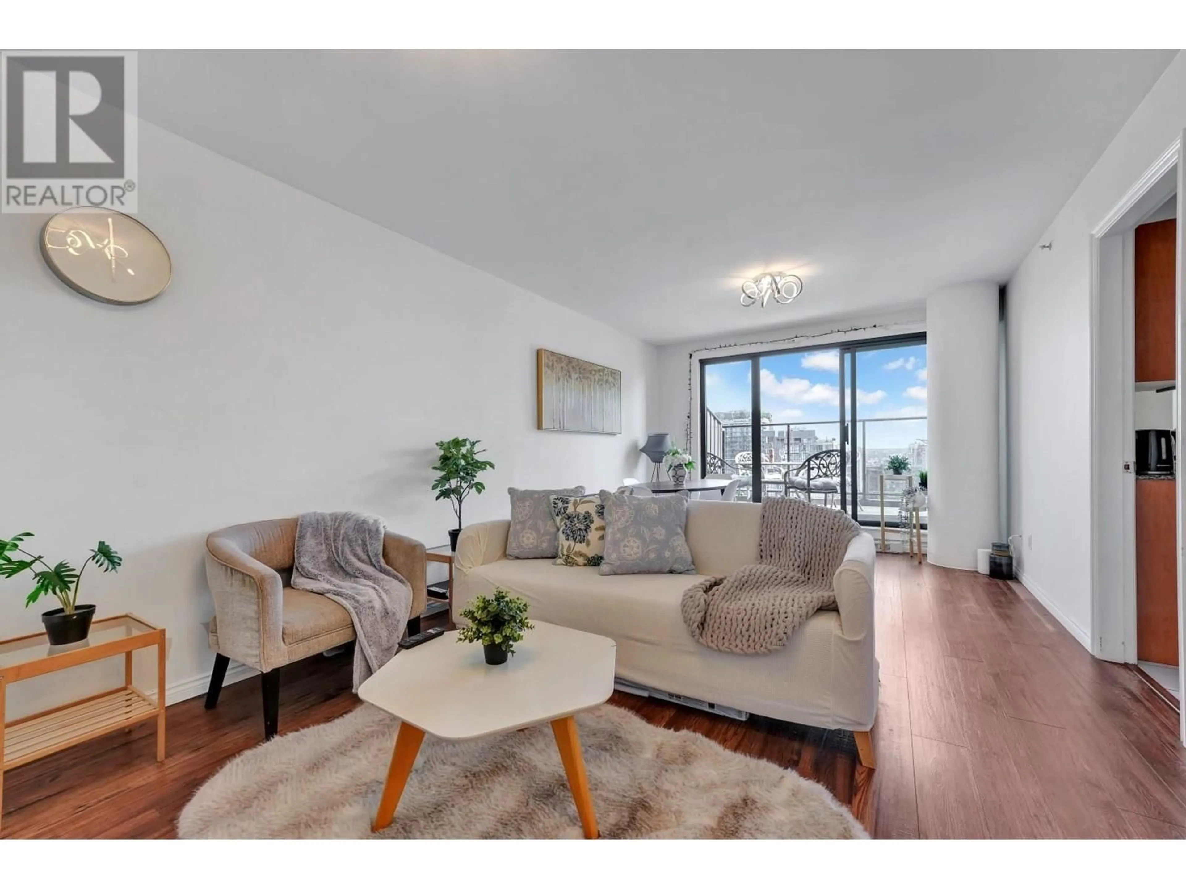 Living room with furniture, wood/laminate floor for 2703 - 1189 HOWE STREET, Vancouver British Columbia V6Z2X4
