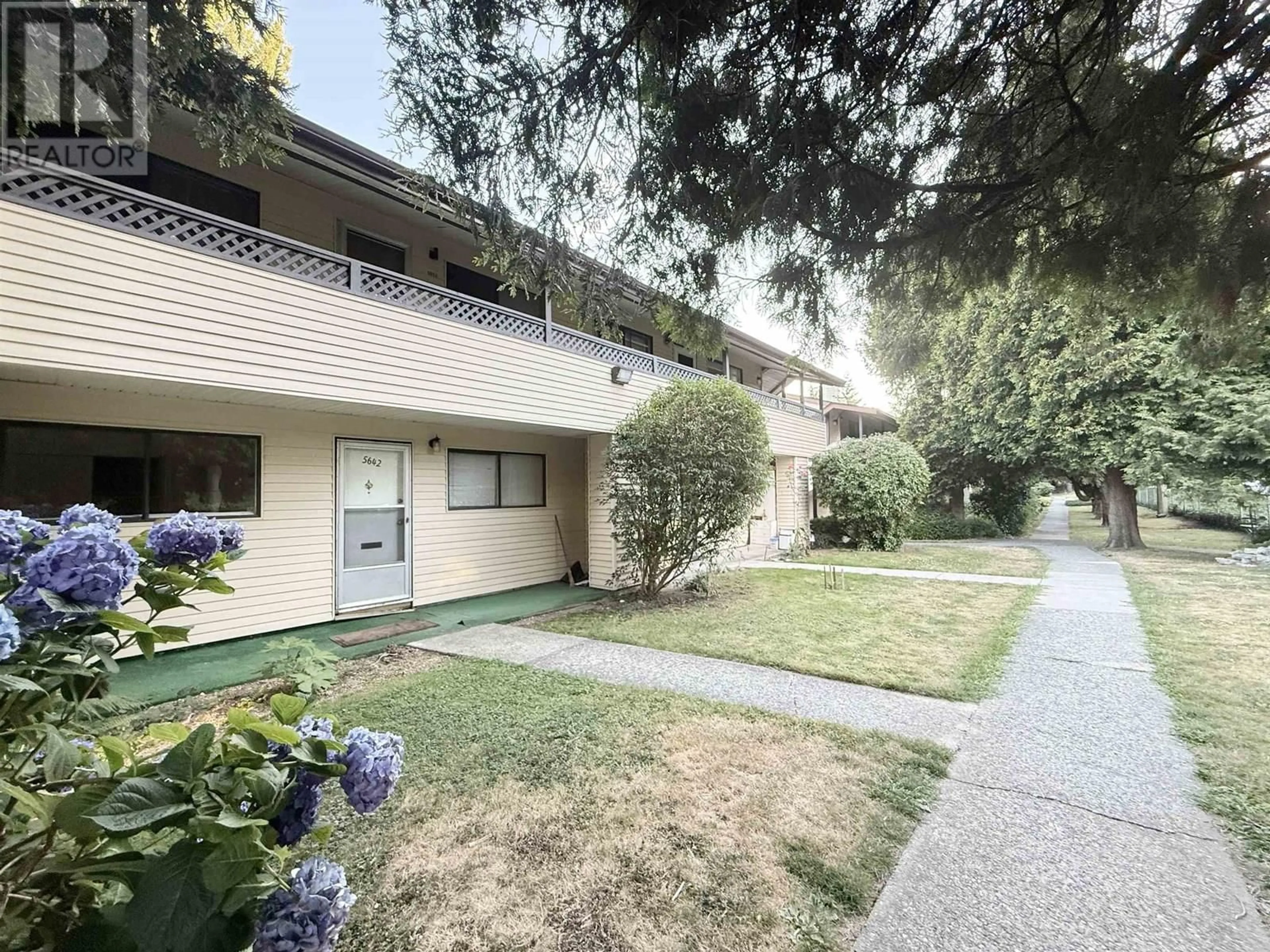 A pic from outside/outdoor area/front of a property/back of a property/a pic from drone, street for 5642 BROADWAY, Burnaby British Columbia V5B1W7