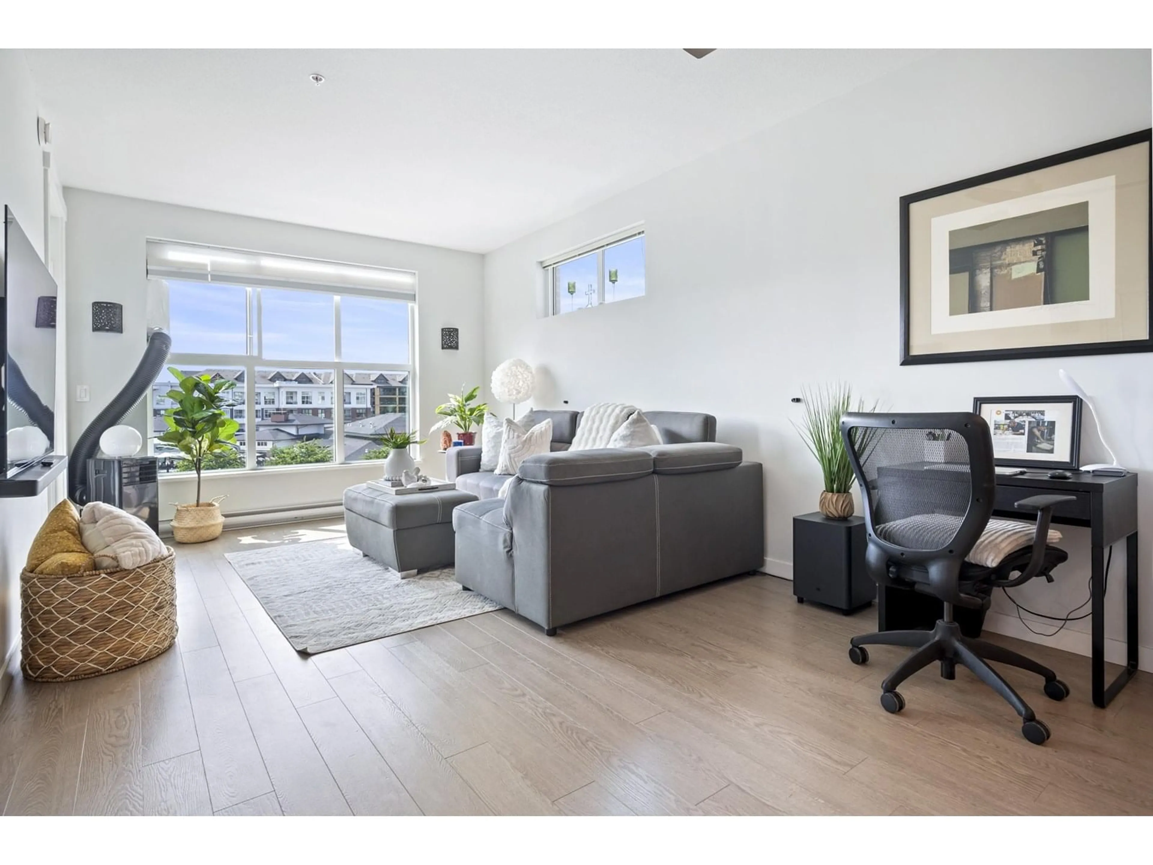 Living room with furniture, wood/laminate floor for C302 - 8150 207, Langley British Columbia V2Y4J4