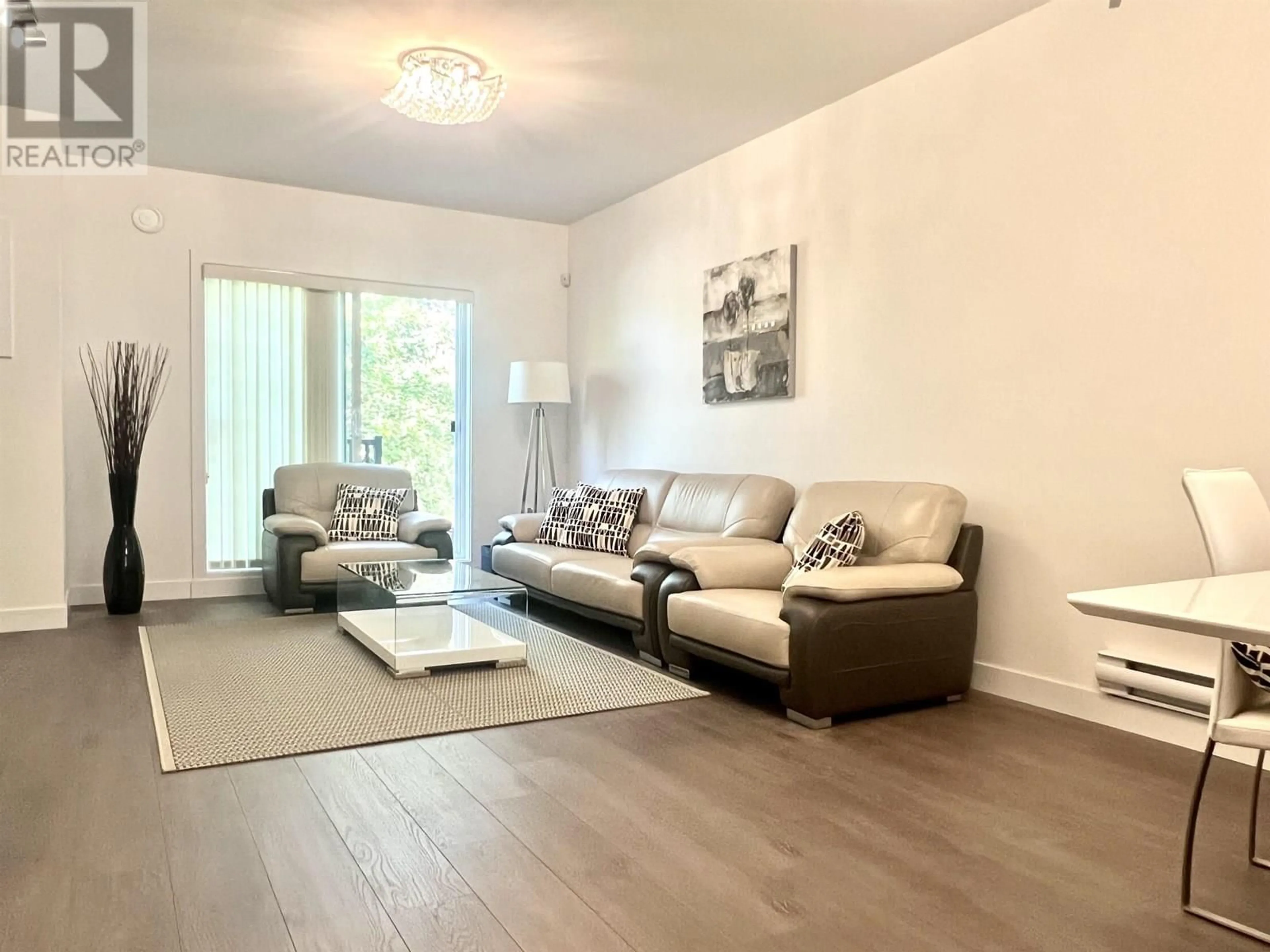 Living room with furniture, wood/laminate floor for 105 - 9080 NO. 3 ROAD, Richmond British Columbia V7A1V9