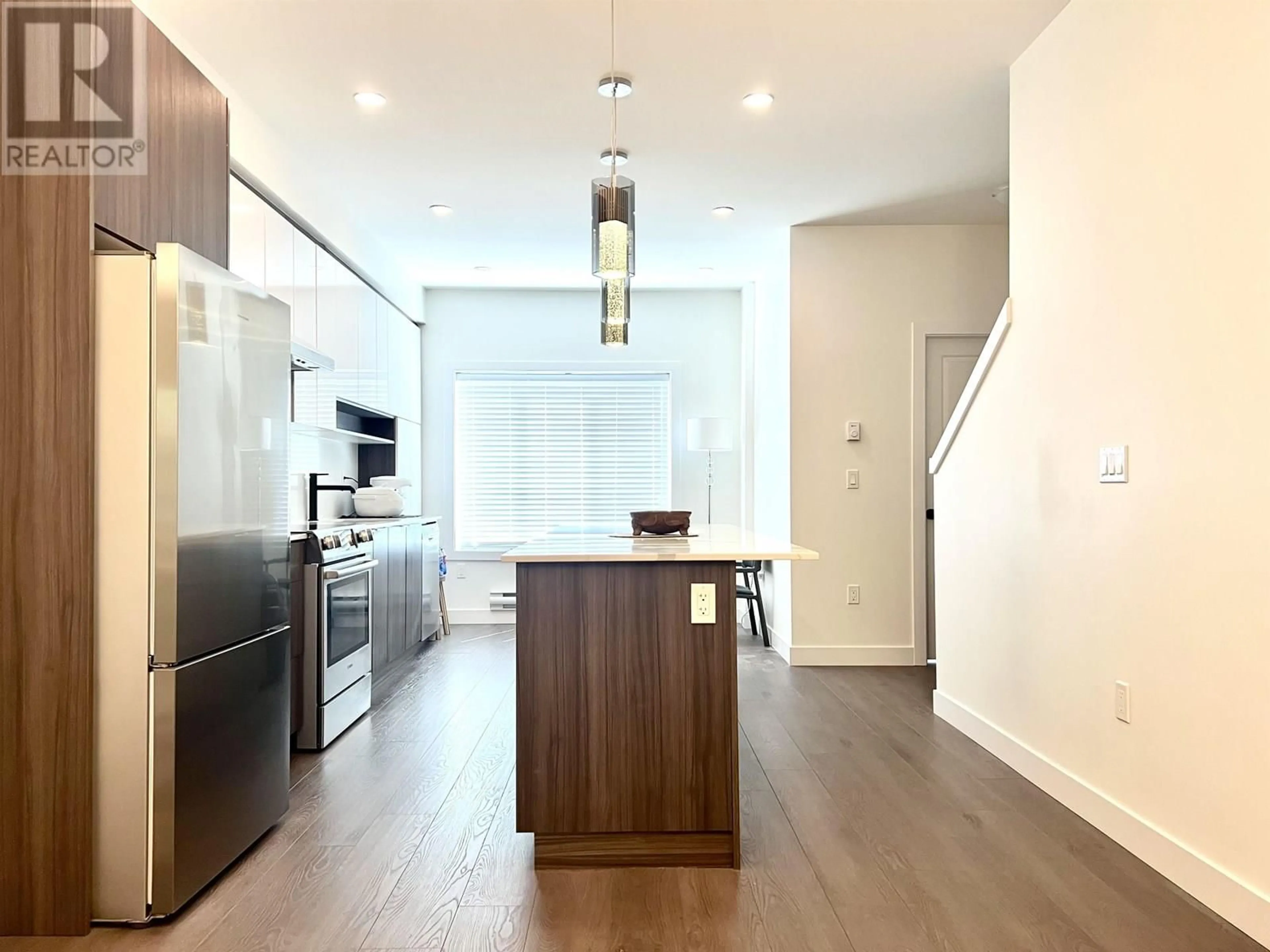 Open concept kitchen, wood/laminate floor for 105 - 9080 NO. 3 ROAD, Richmond British Columbia V7A1V9