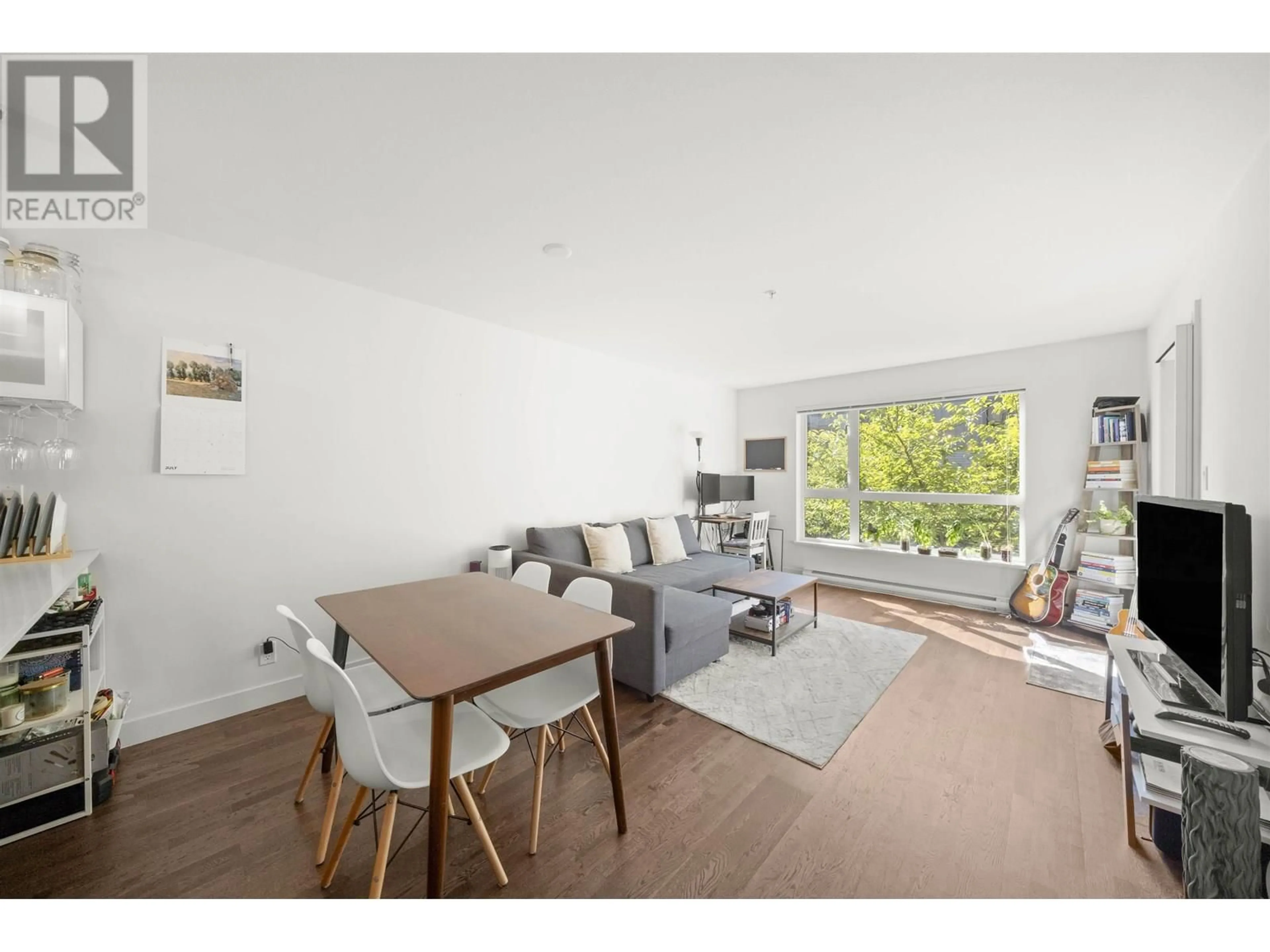 Living room with furniture, wood/laminate floor for 218 - 7058 14TH AVENUE, Burnaby British Columbia V3N0E6
