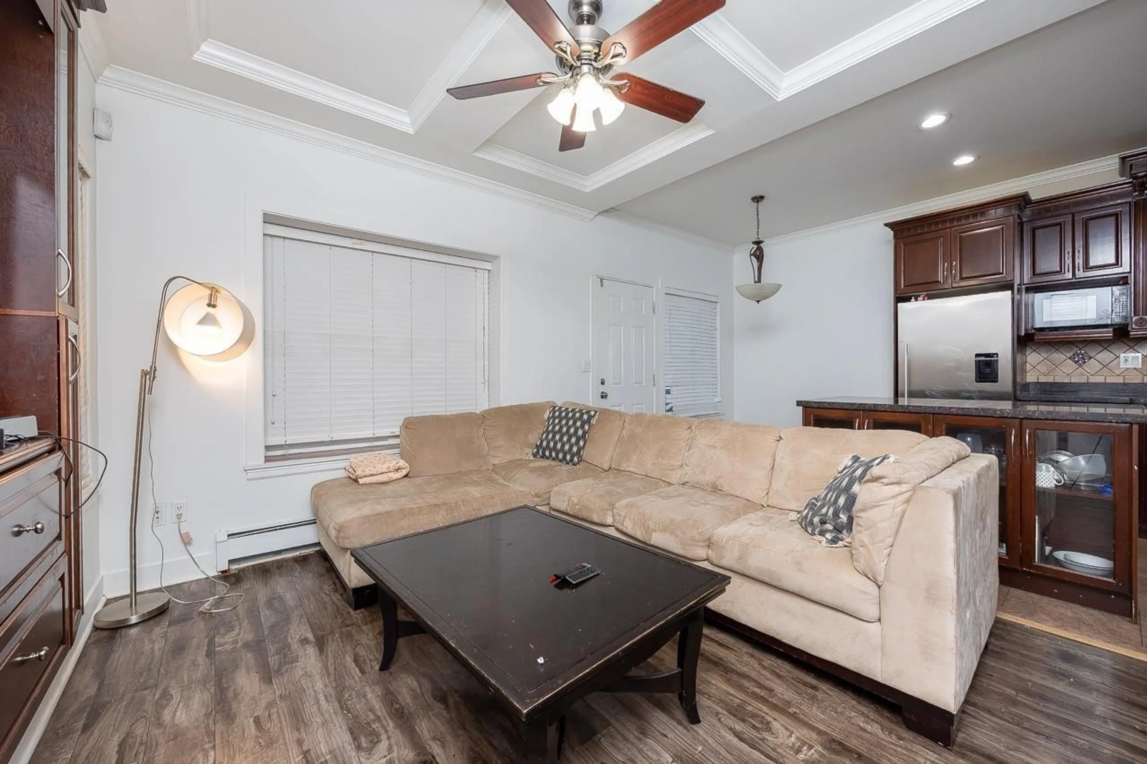 Living room with furniture, wood/laminate floor for 14185 62A, Surrey British Columbia V3X0B2