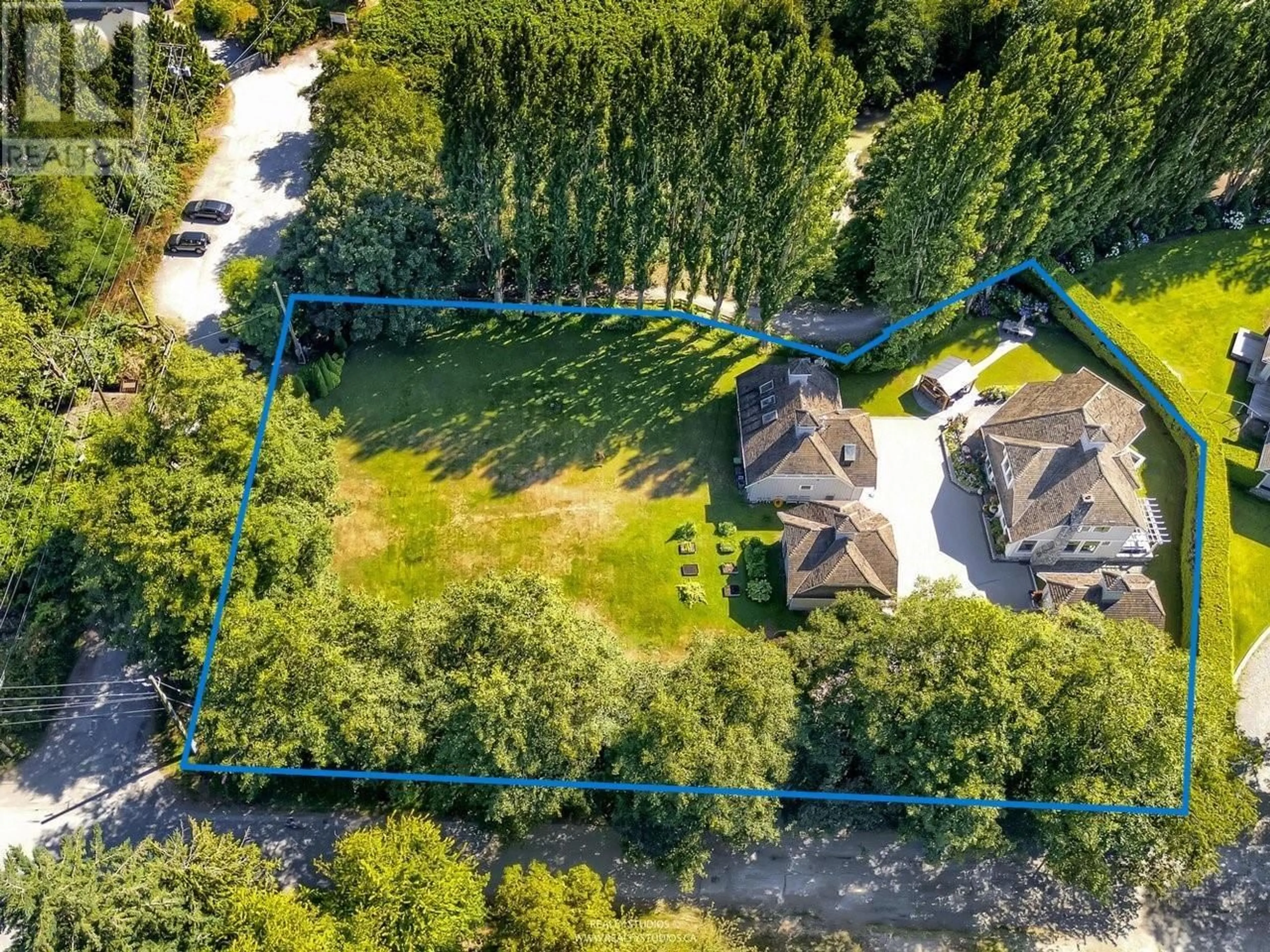 A pic from outside/outdoor area/front of a property/back of a property/a pic from drone, forest/trees view for 3380 CELTIC AVENUE, Vancouver British Columbia V6N4J5