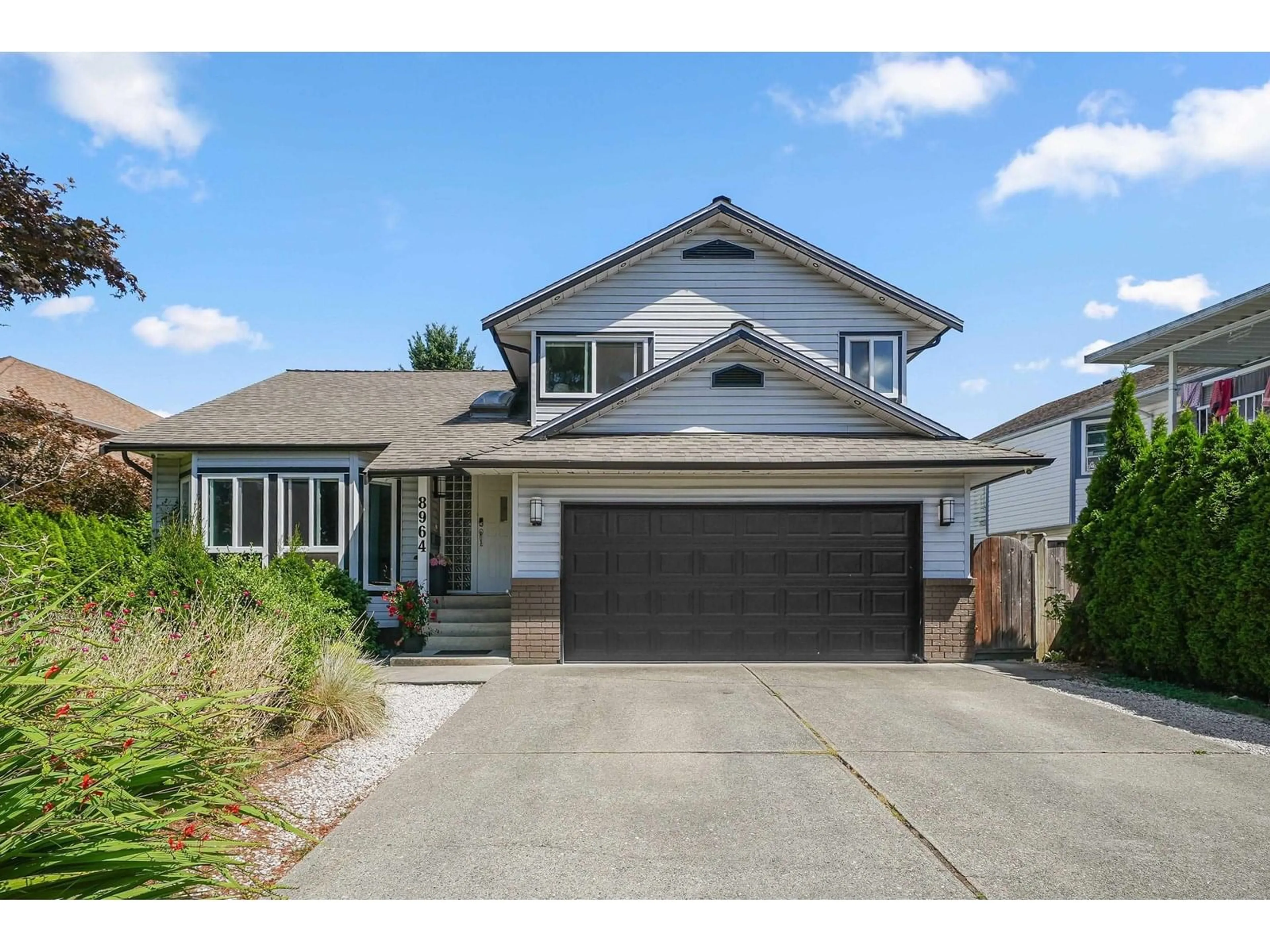 Home with vinyl exterior material, street for 8964 142A, Surrey British Columbia V3V7T1