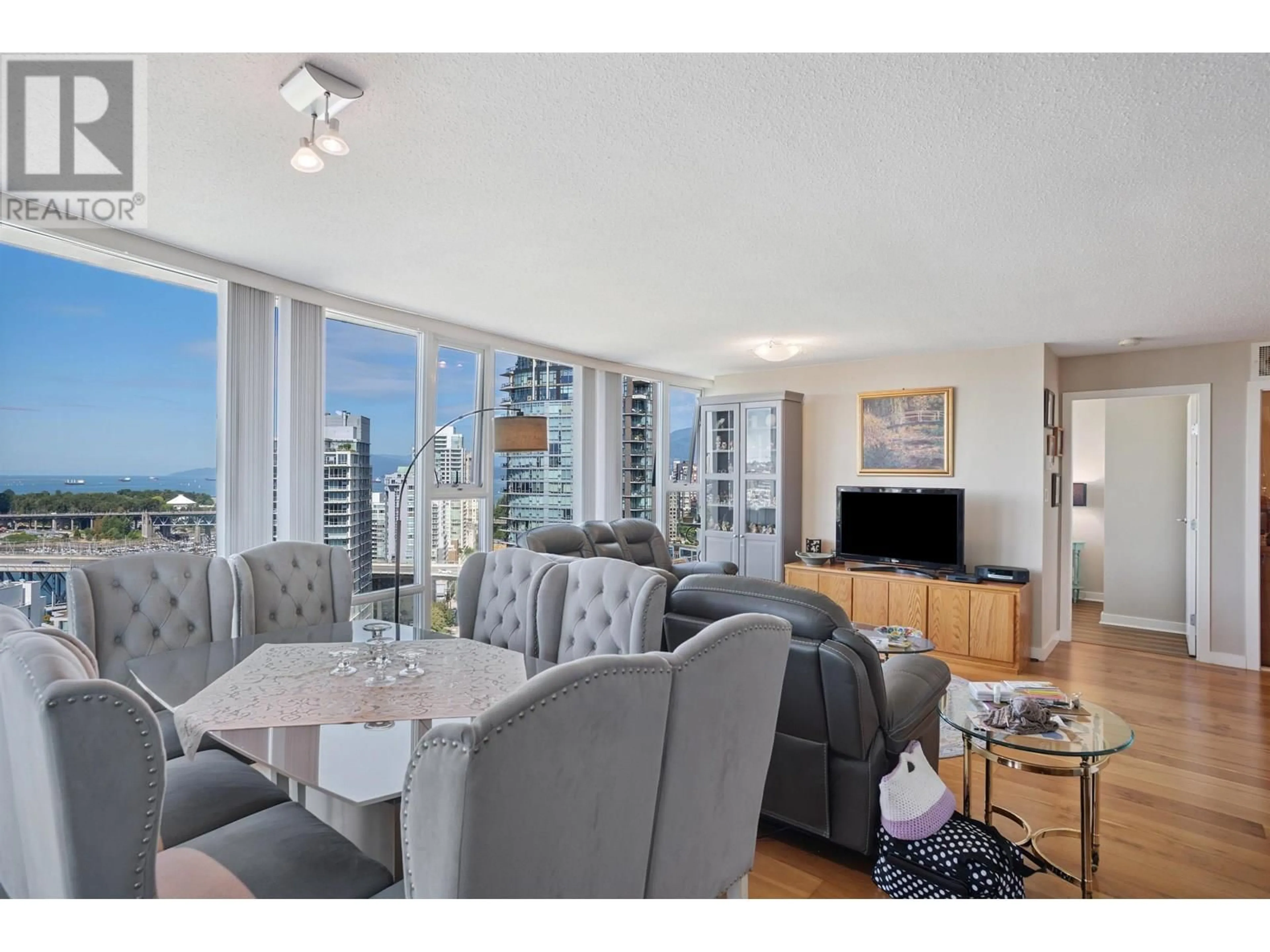 Living room with furniture, wood/laminate floor for 2703 - 455 BEACH CRESCENT, Vancouver British Columbia V6Z3E5