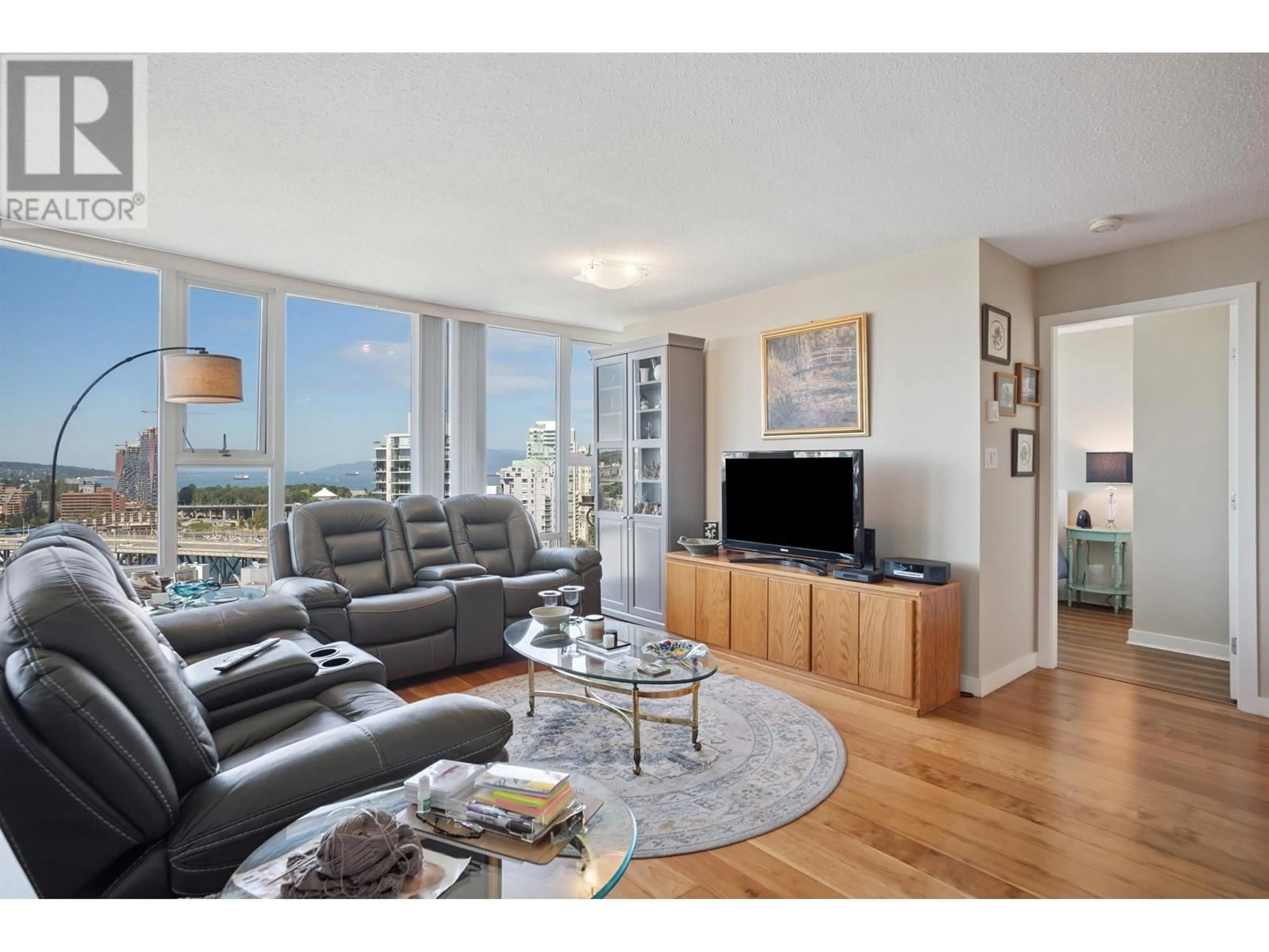 Living room with furniture, wood/laminate floor for 2703 - 455 BEACH CRESCENT, Vancouver British Columbia V6Z3E5
