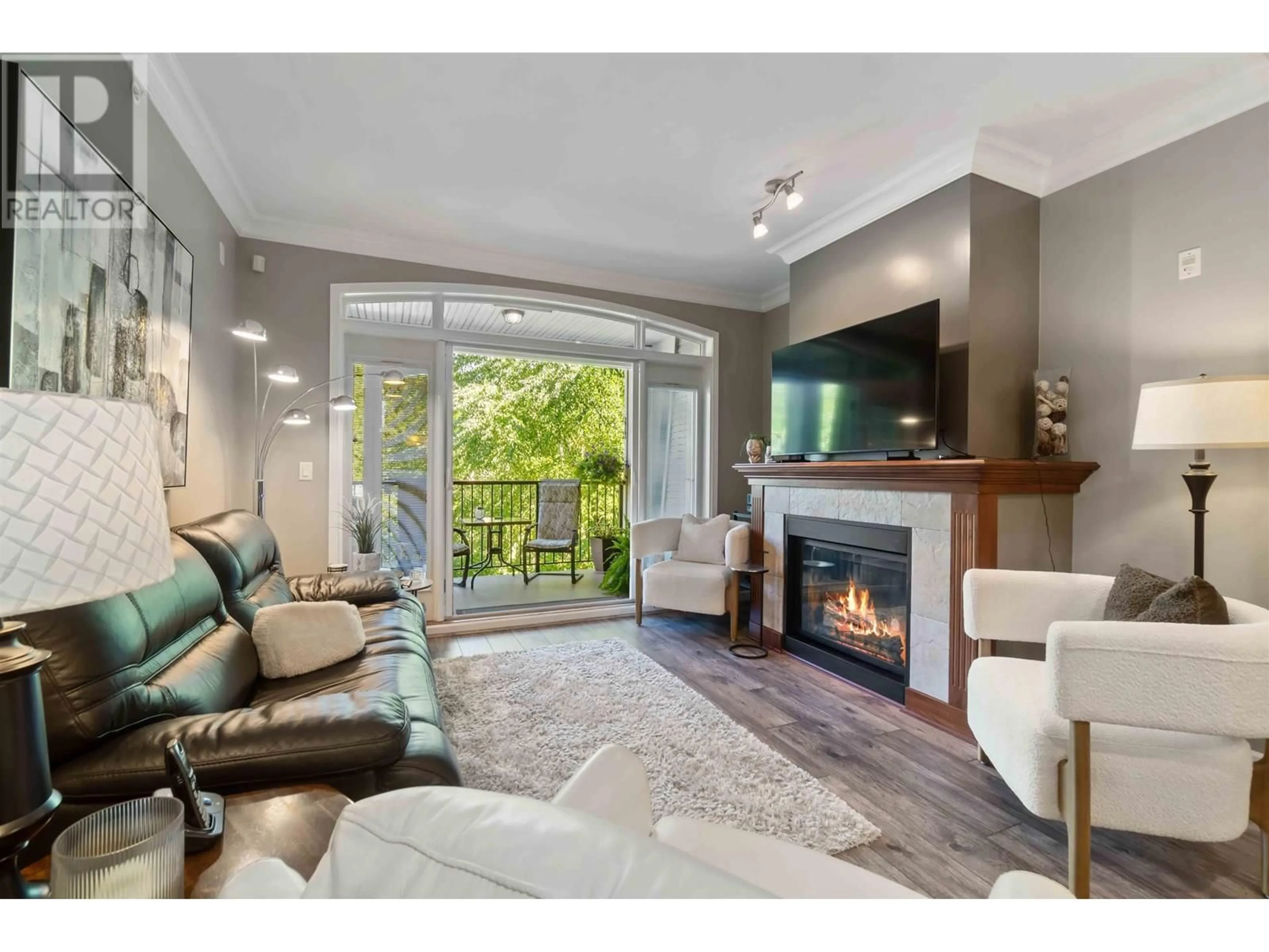 Living room with furniture, wood/laminate floor for 318 - 990 ADAIR AVENUE, Coquitlam British Columbia V3K3V2