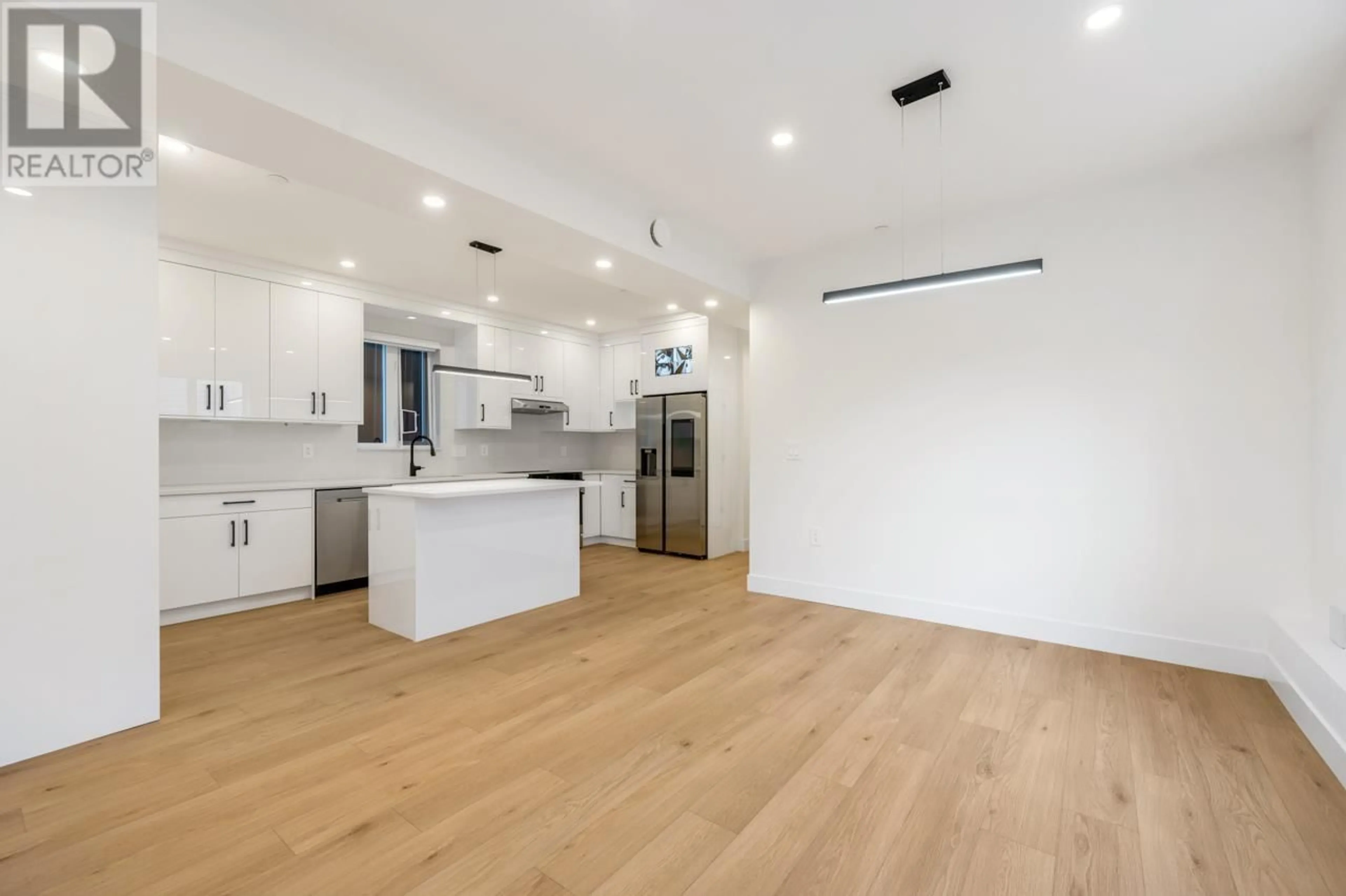 Open concept kitchen, wood/laminate floor for 2 - 3090 VANNESS AVENUE, Vancouver British Columbia V5R5A1