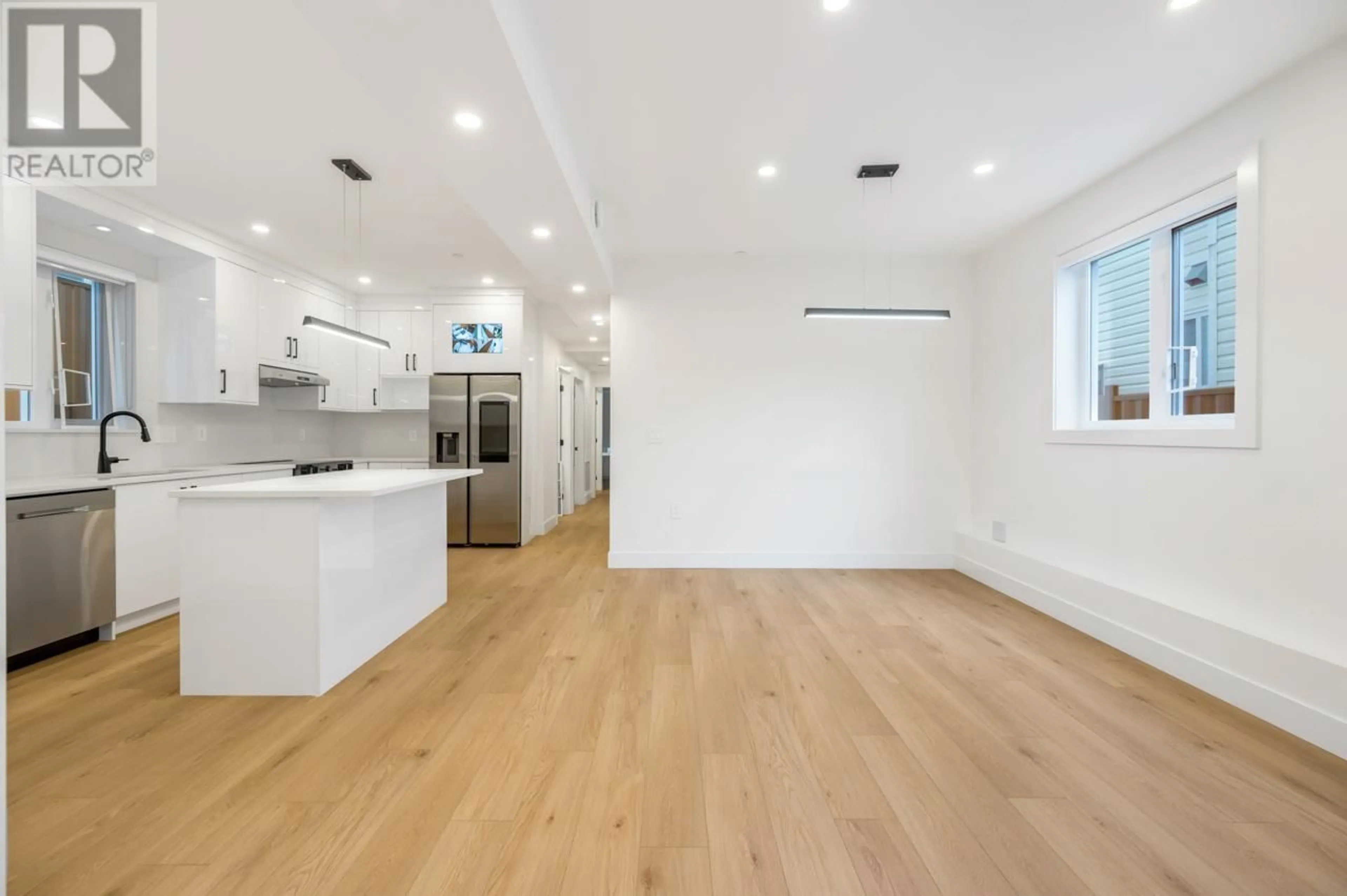 Open concept kitchen, wood/laminate floor for 2 - 3090 VANNESS AVENUE, Vancouver British Columbia V5R5A1