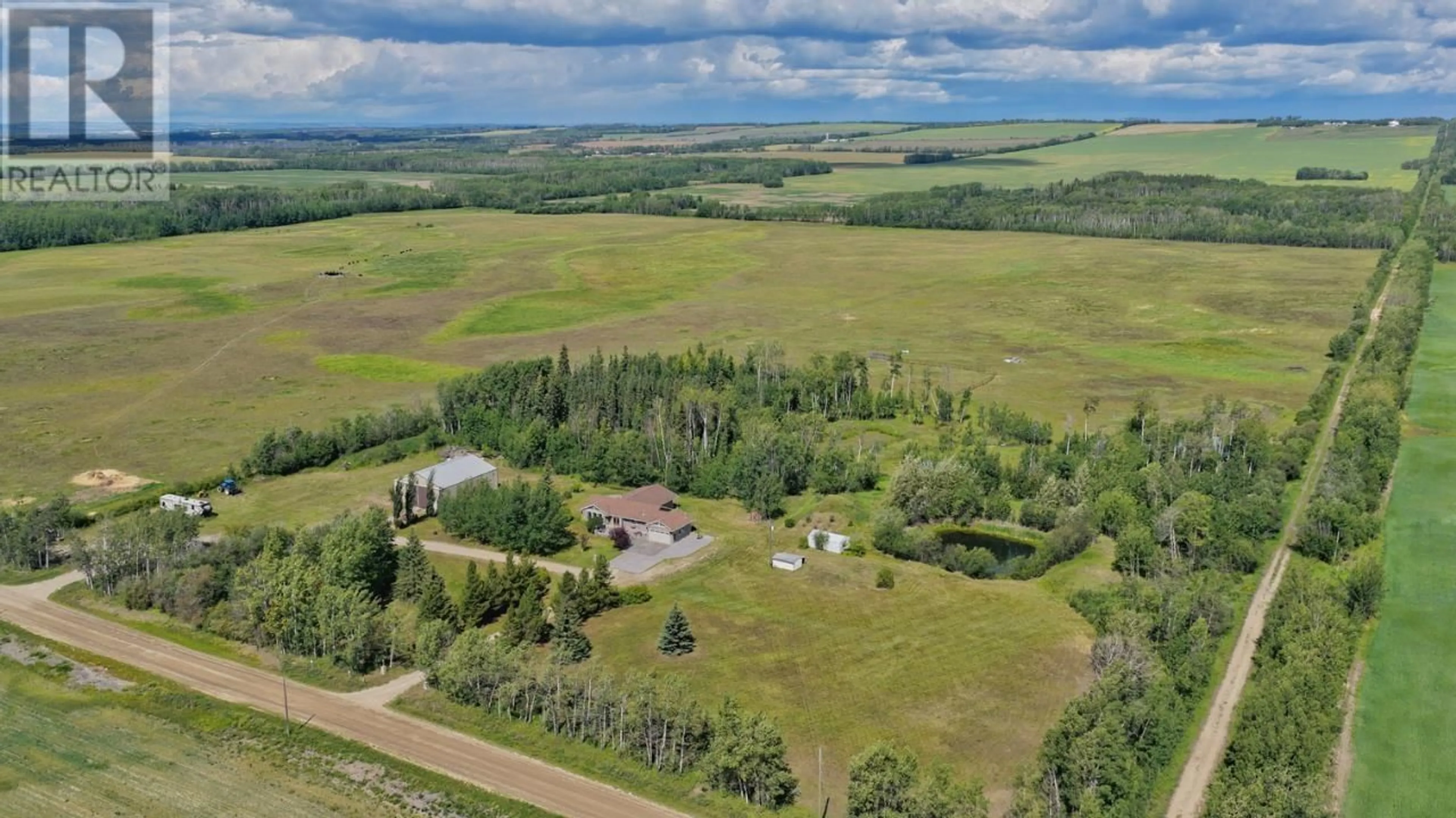 A pic from outside/outdoor area/front of a property/back of a property/a pic from drone, unknown for 5014 238 ROAD, Fort St. John British Columbia V0C1C4