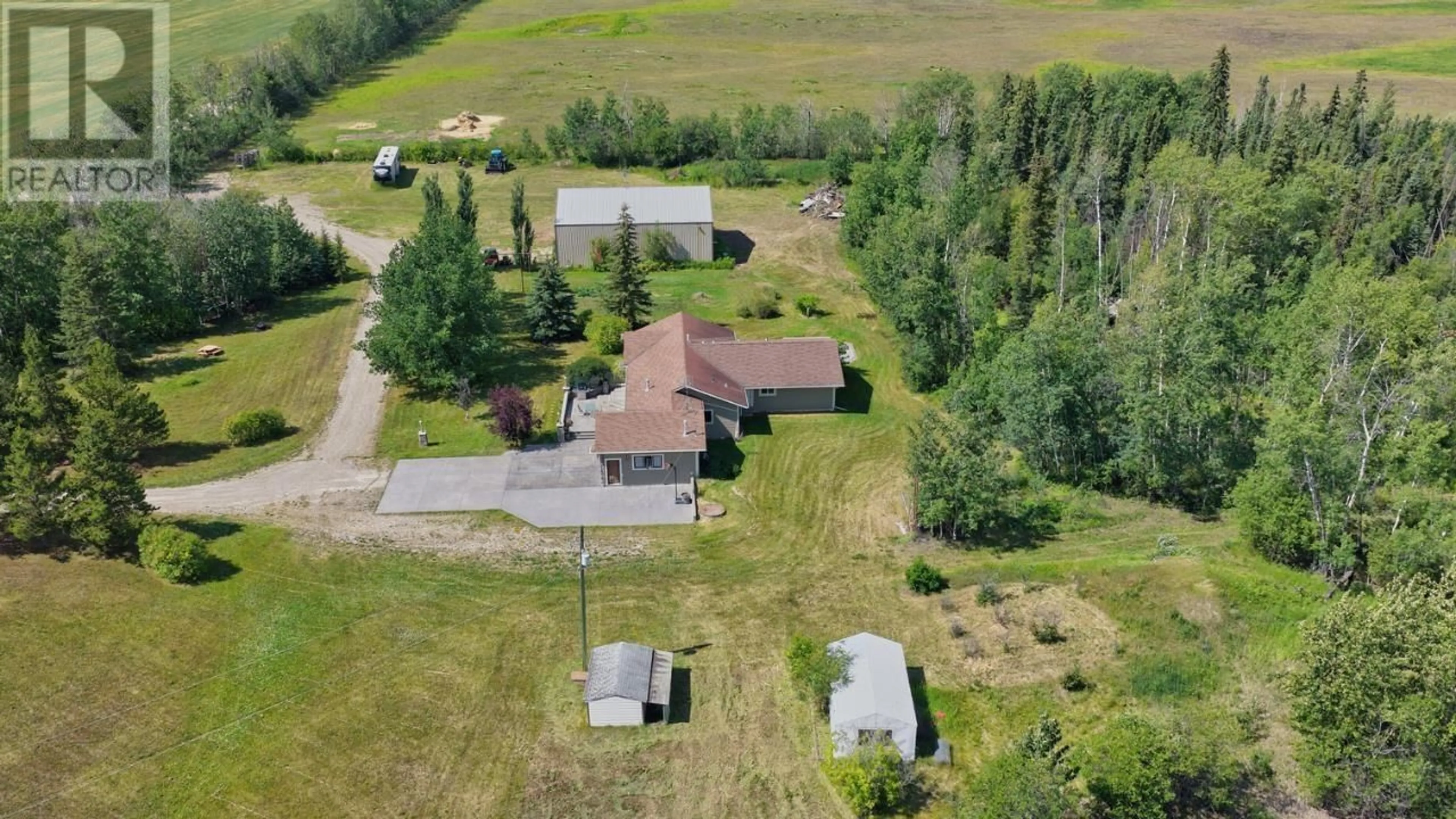 A pic from outside/outdoor area/front of a property/back of a property/a pic from drone, unknown for 5014 238 ROAD, Fort St. John British Columbia V0C1C4