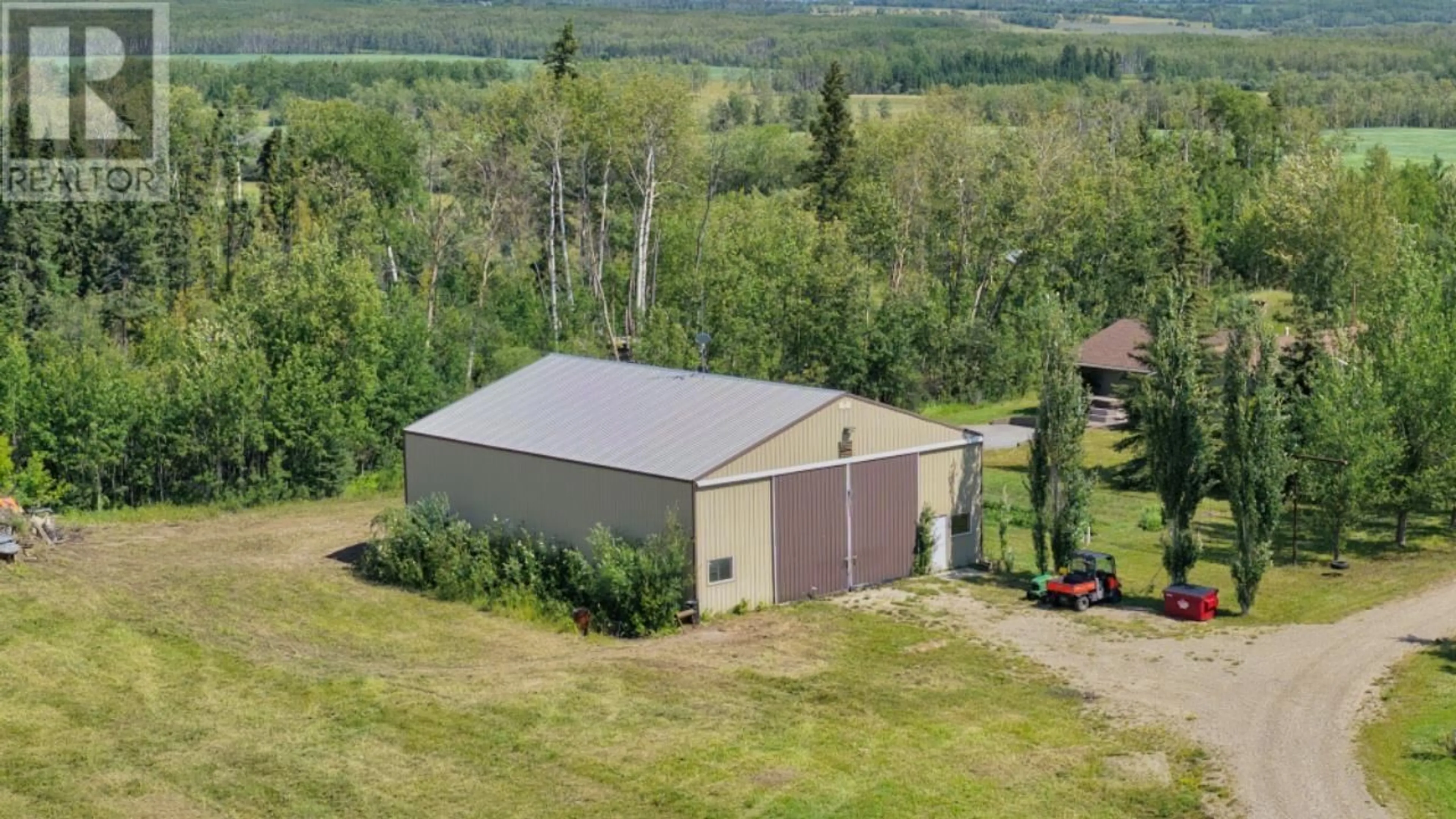 A pic from outside/outdoor area/front of a property/back of a property/a pic from drone, building for 5014 238 ROAD, Fort St. John British Columbia V0C1C4