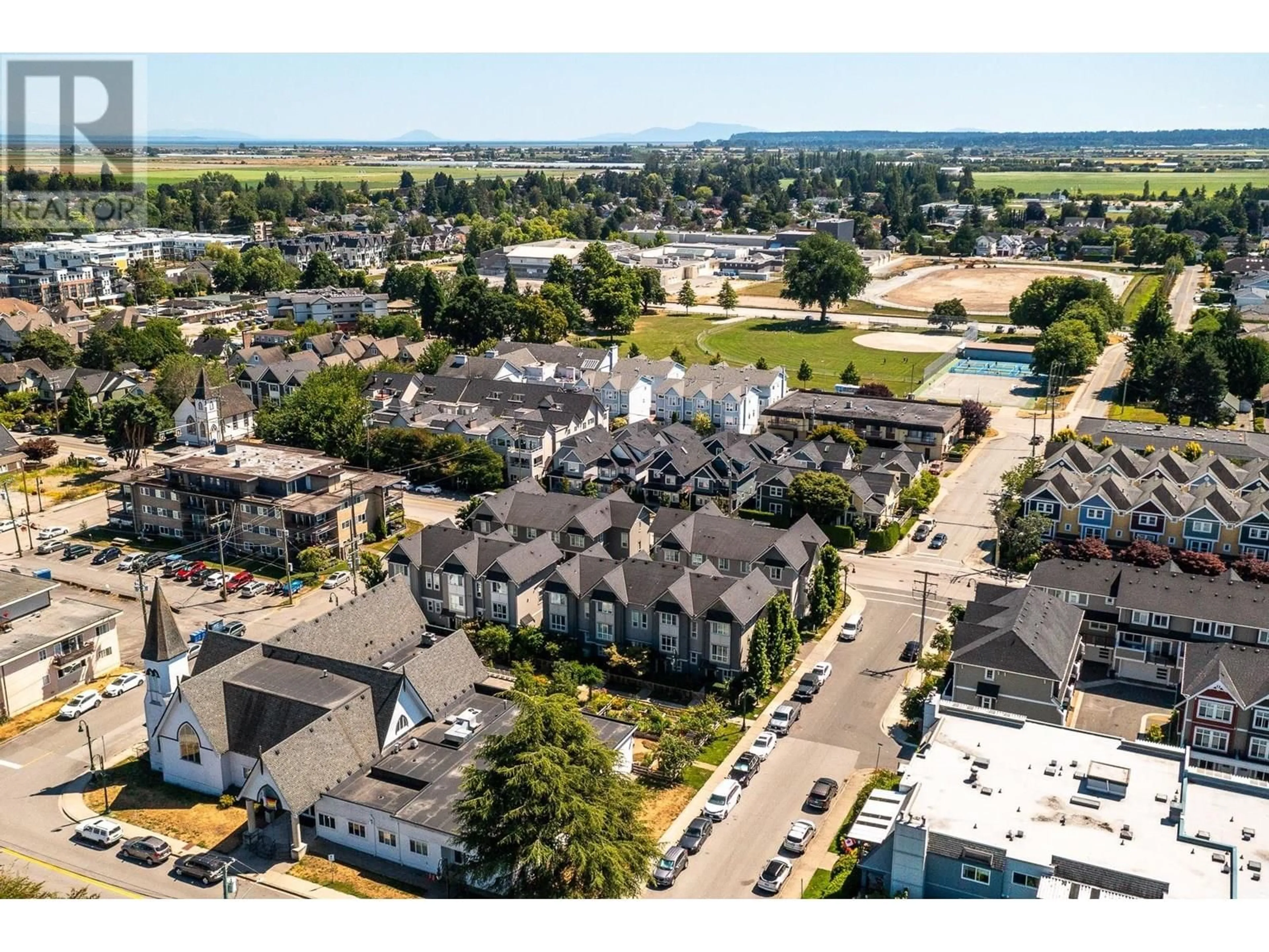 A pic from outside/outdoor area/front of a property/back of a property/a pic from drone, mountain view for 14 - 4949 47A AVENUE, Delta British Columbia V4K1T6