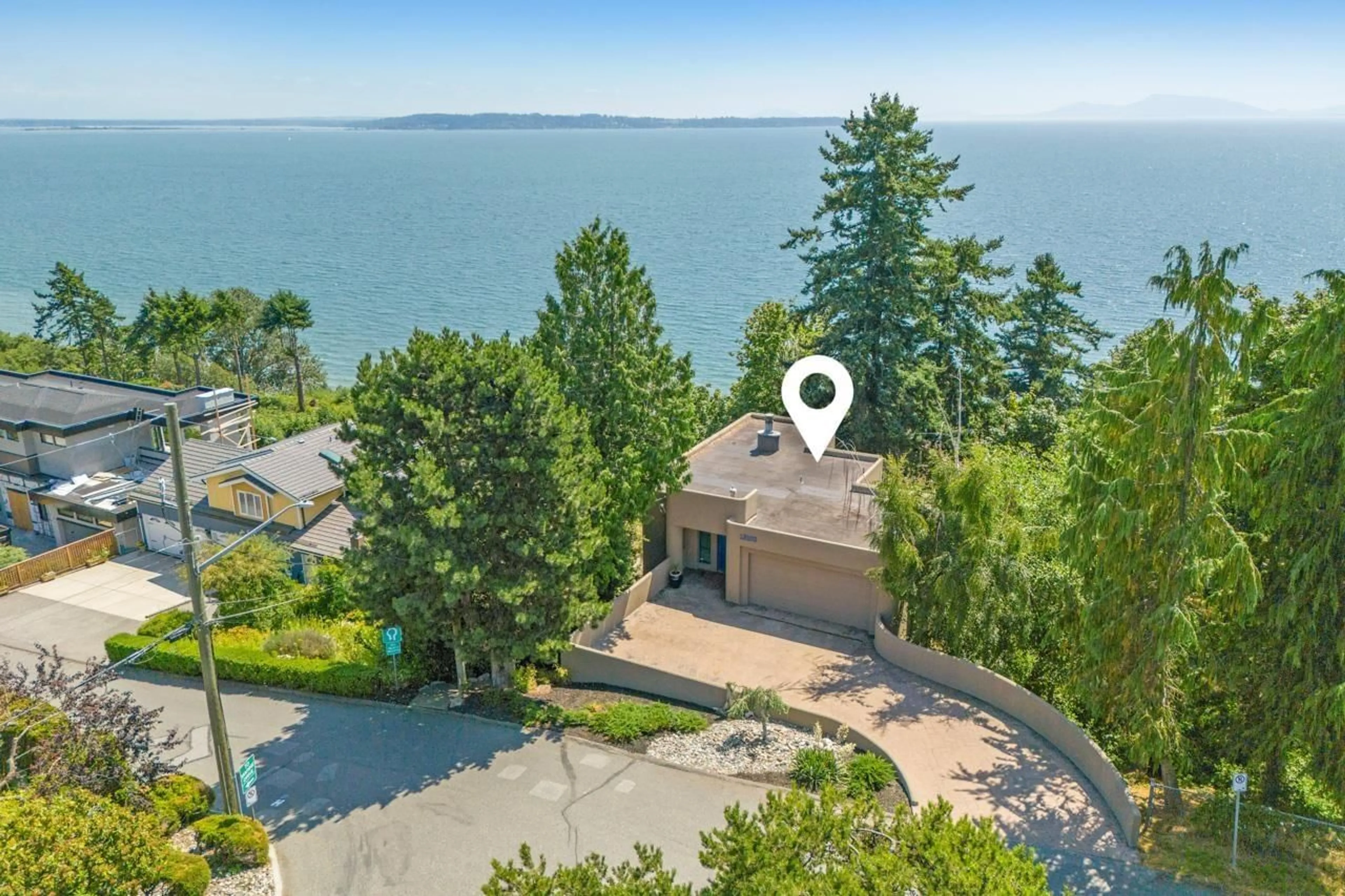 A pic from outside/outdoor area/front of a property/back of a property/a pic from drone, water/lake/river/ocean view for 13102 13, Surrey British Columbia V4A1B8