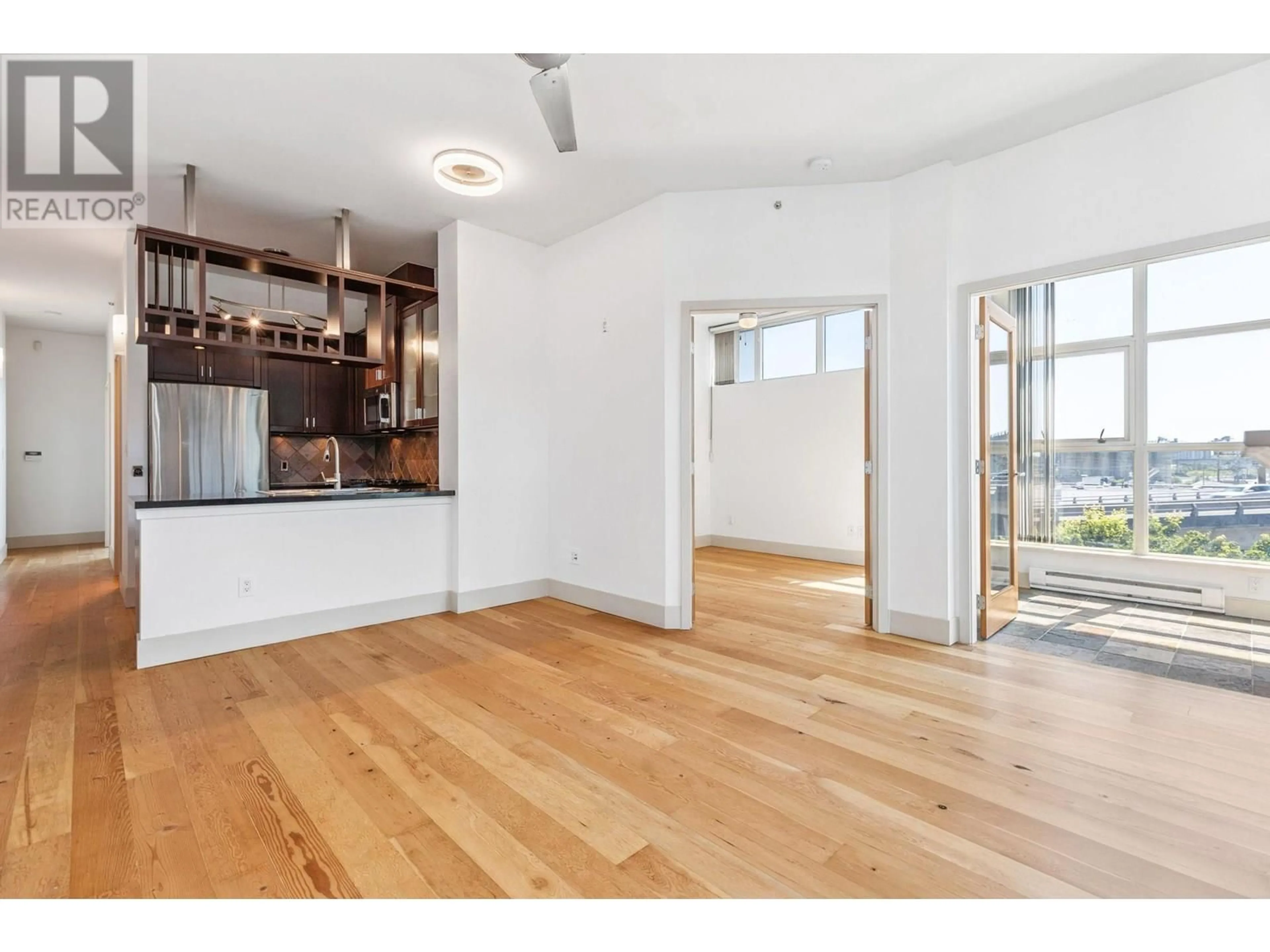 Open concept kitchen, wood/laminate floor for 423 - 8988 HUDSON STREET, Vancouver British Columbia V6P6Z1