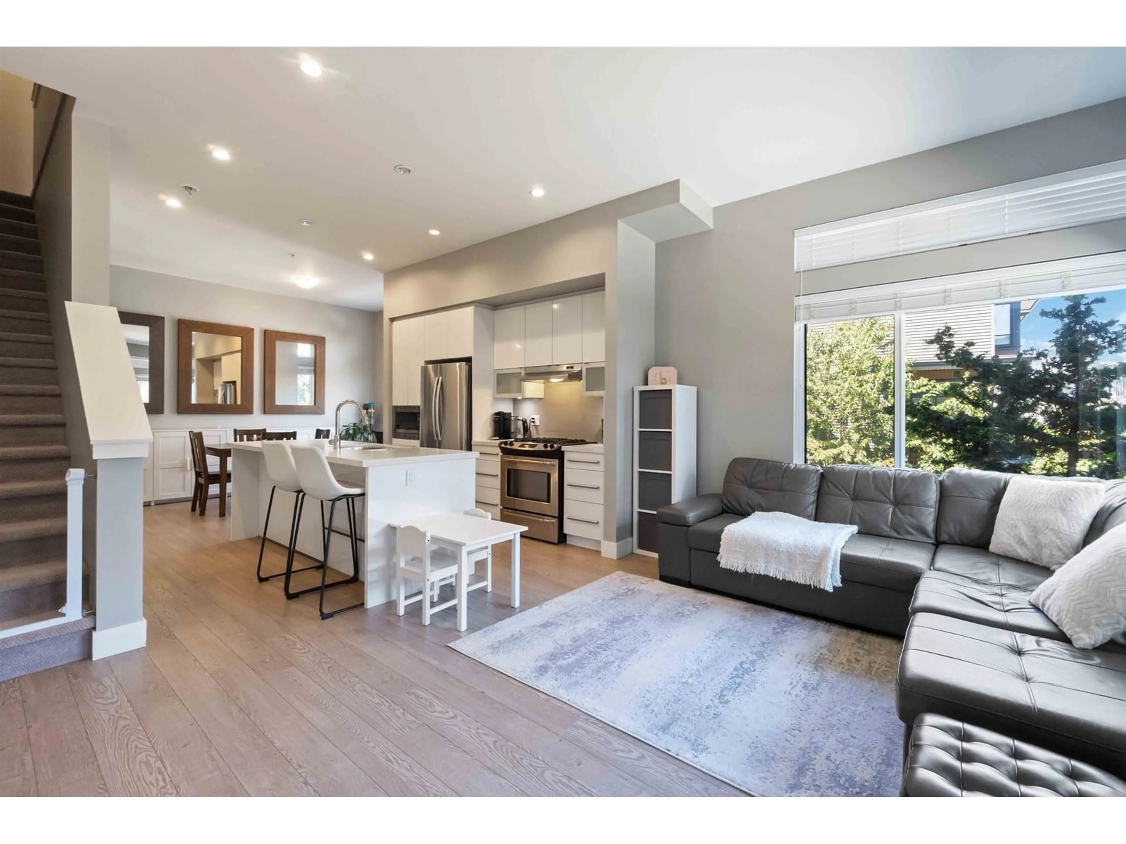 Open concept kitchen, wood/laminate floor for 55 - 7811 209, Langley British Columbia V2Y0P2