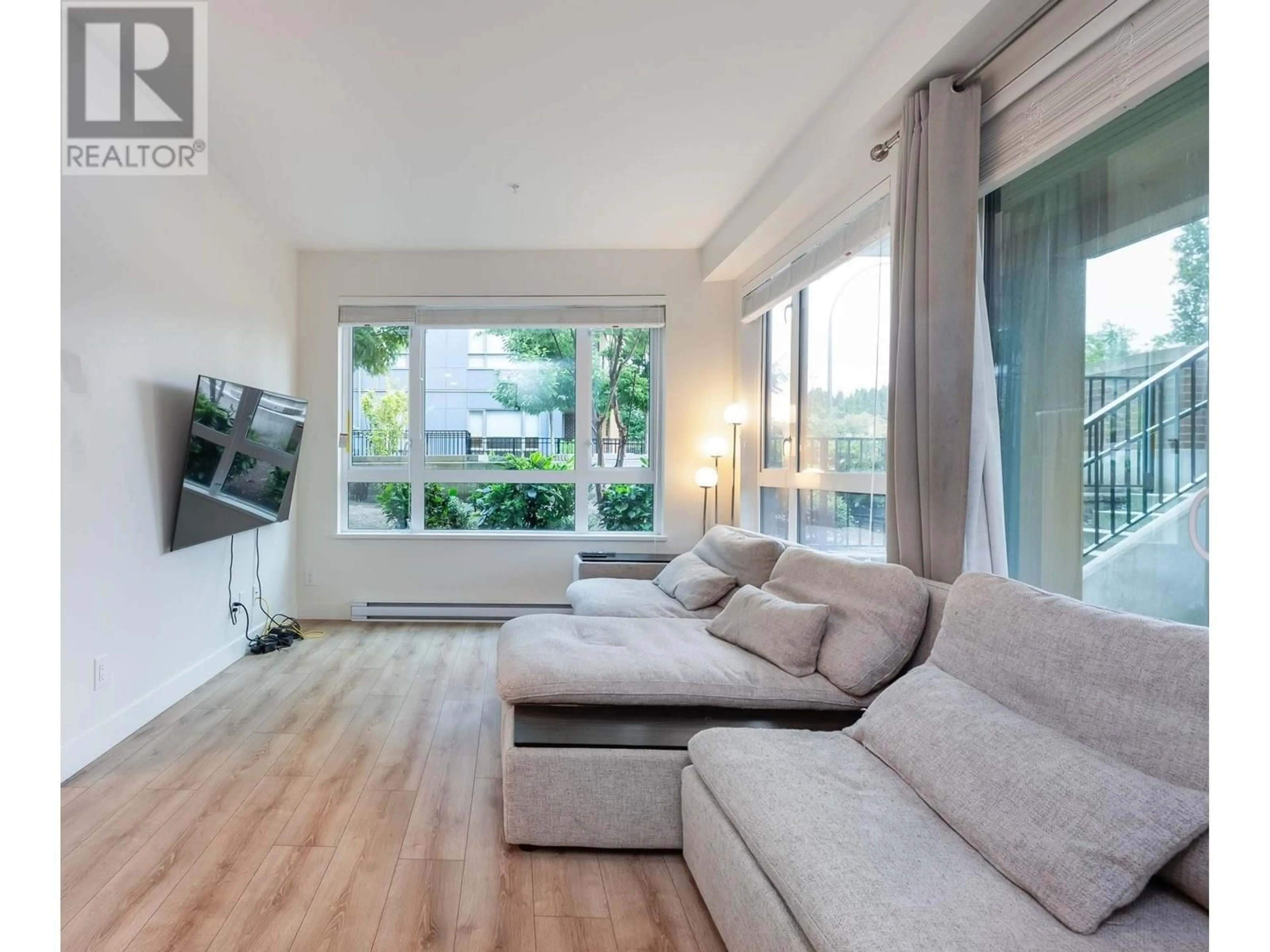 Living room with furniture, wood/laminate floor for 121 - 721 ANSKAR COURT, Coquitlam British Columbia V3J0L4