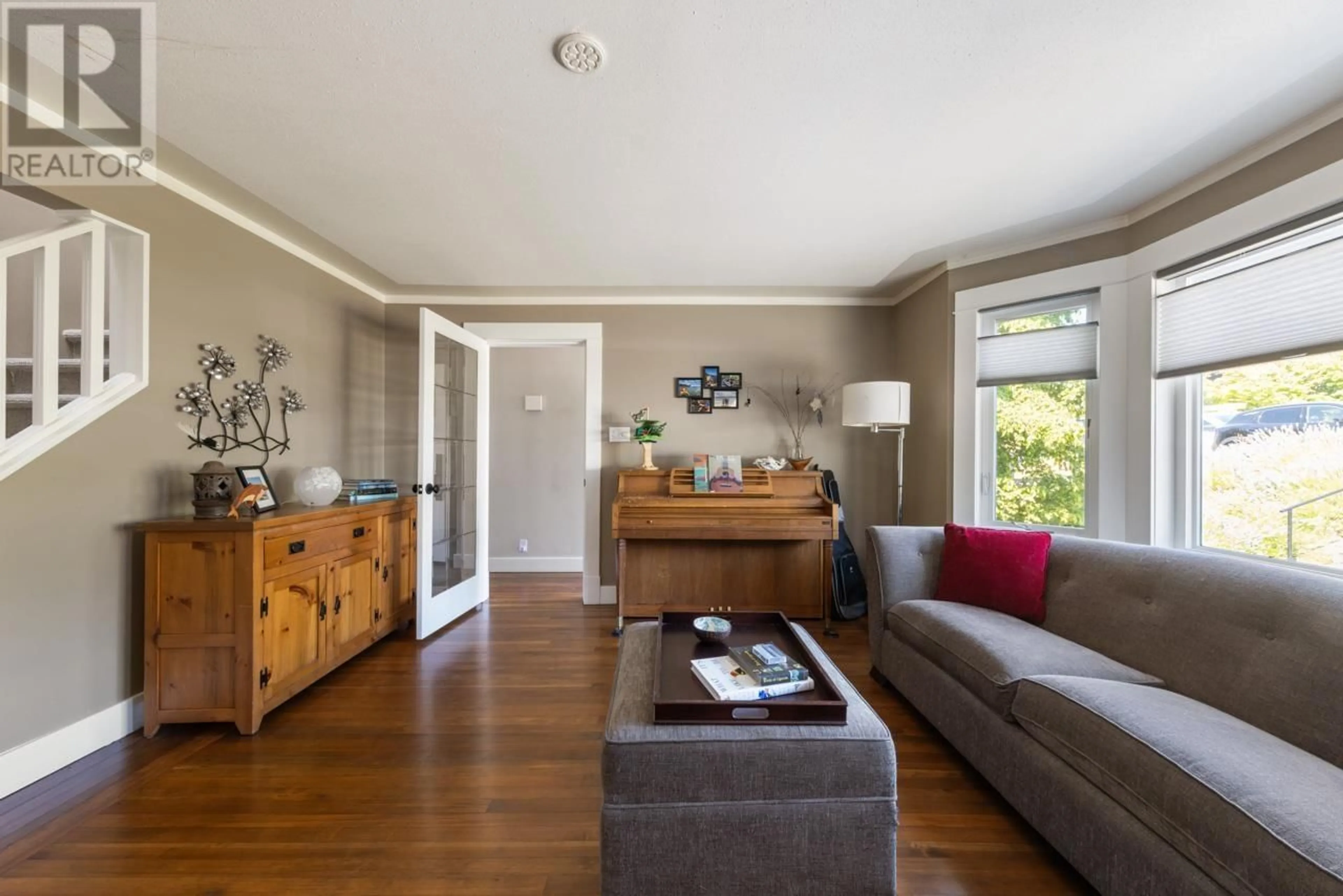 Living room with furniture, wood/laminate floor for 859 CALVERHALL STREET, North Vancouver British Columbia V7L1X8