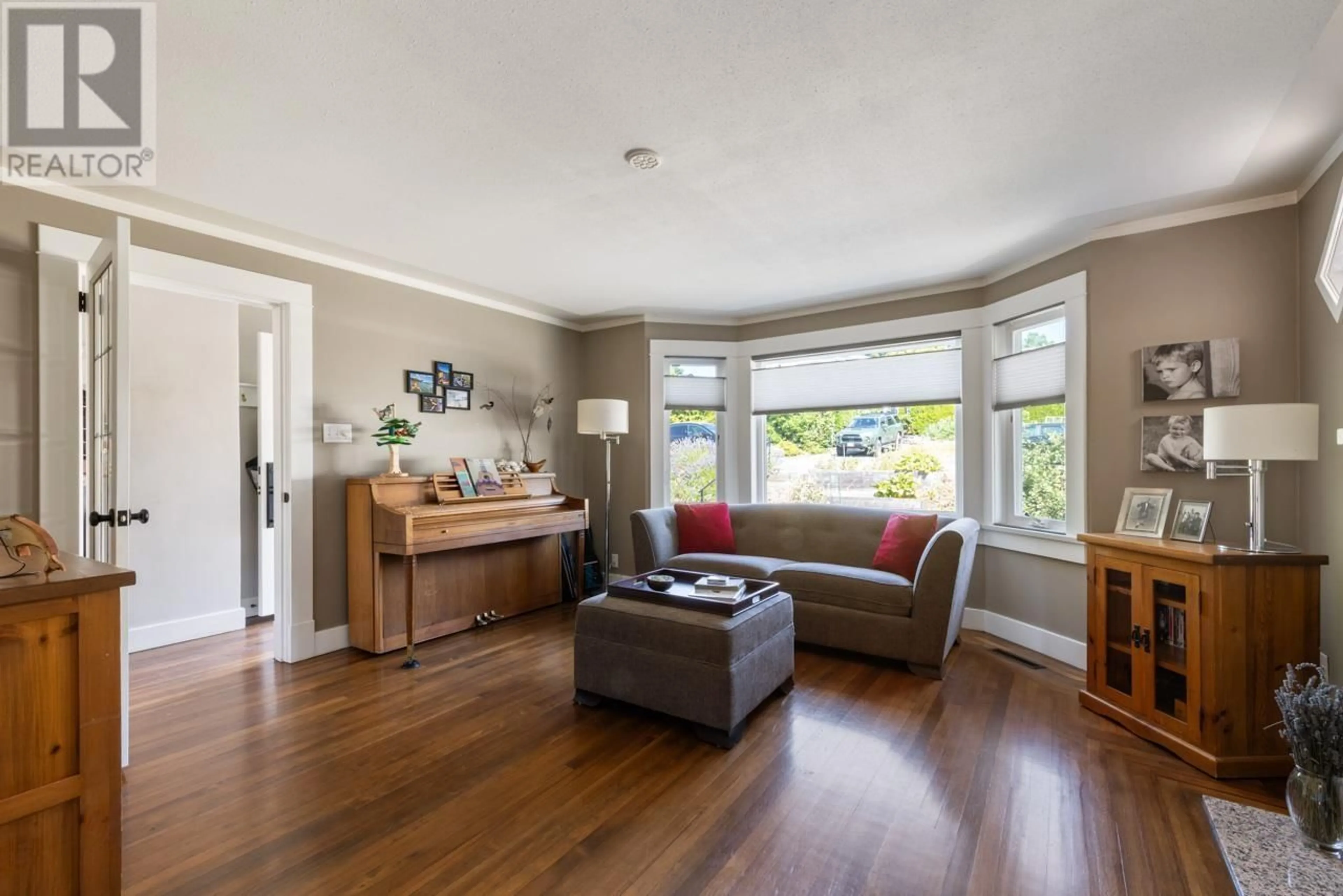 Living room with furniture, wood/laminate floor for 859 CALVERHALL STREET, North Vancouver British Columbia V7L1X8