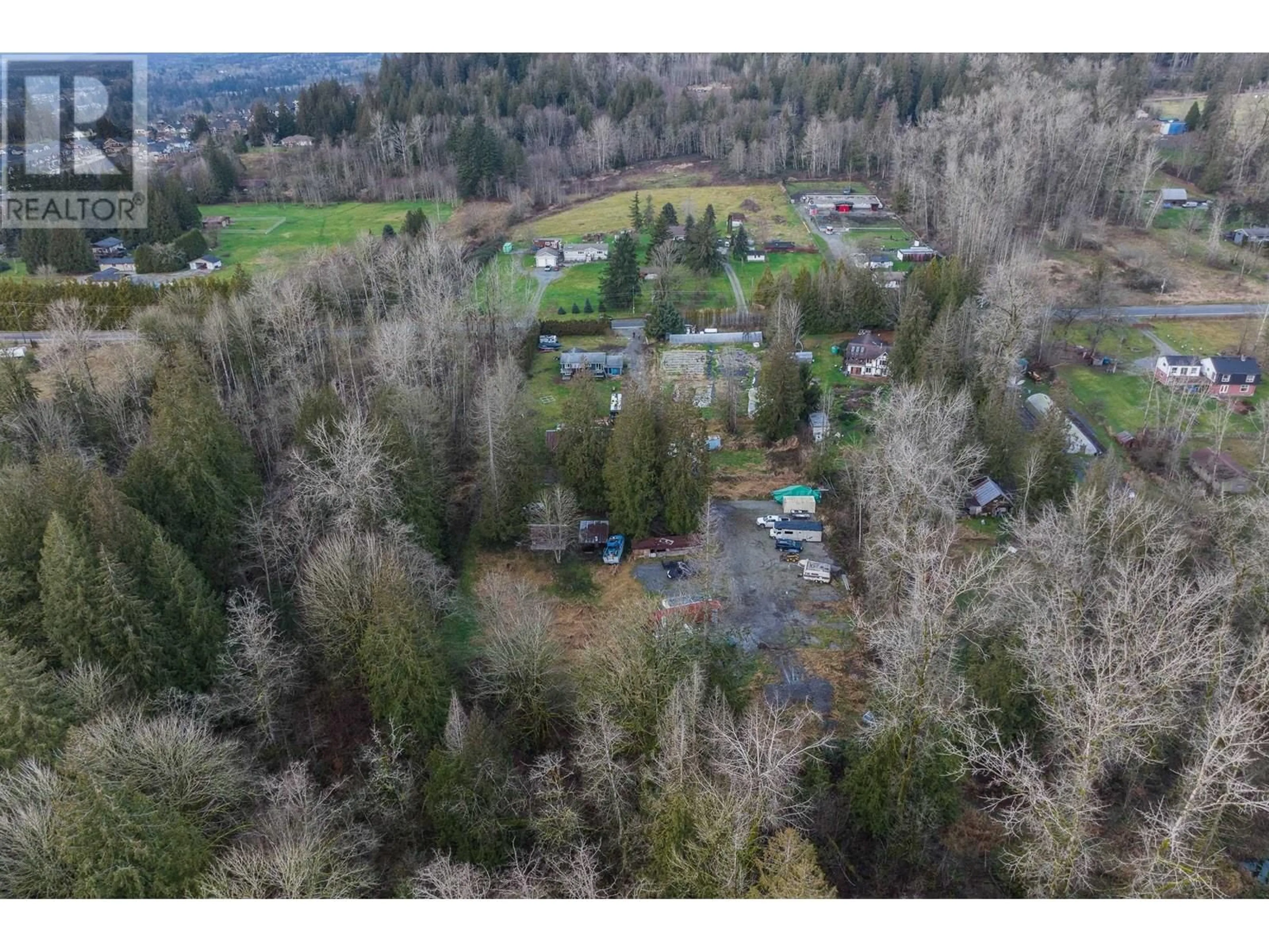A pic from outside/outdoor area/front of a property/back of a property/a pic from drone, forest/trees view for 24950 100 AVENUE, Maple Ridge British Columbia V2W1S3