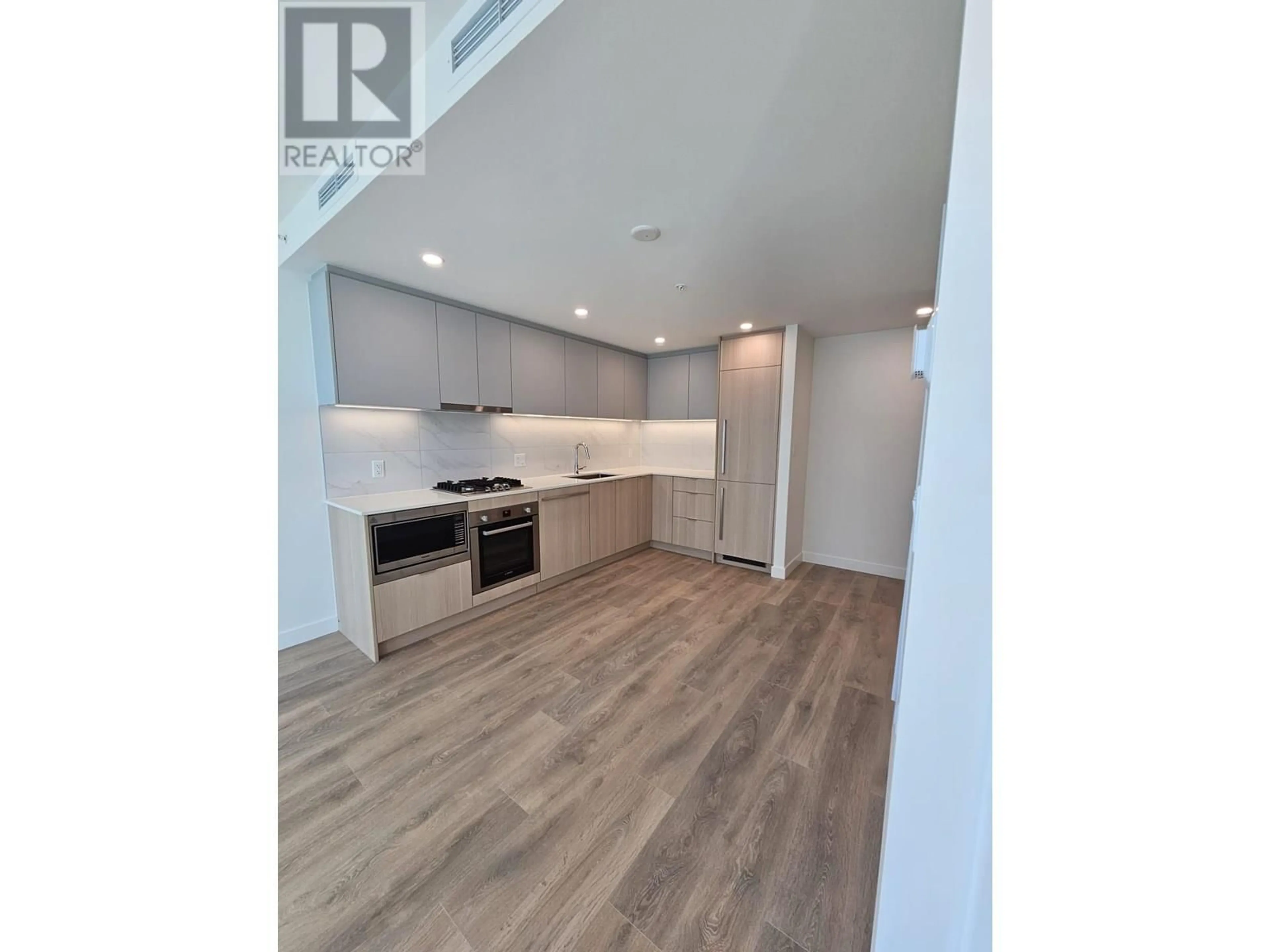 Open concept kitchen, wood/laminate floor for 1305 - 318 ALDERSON AVENUE, Coquitlam British Columbia V3K0J1