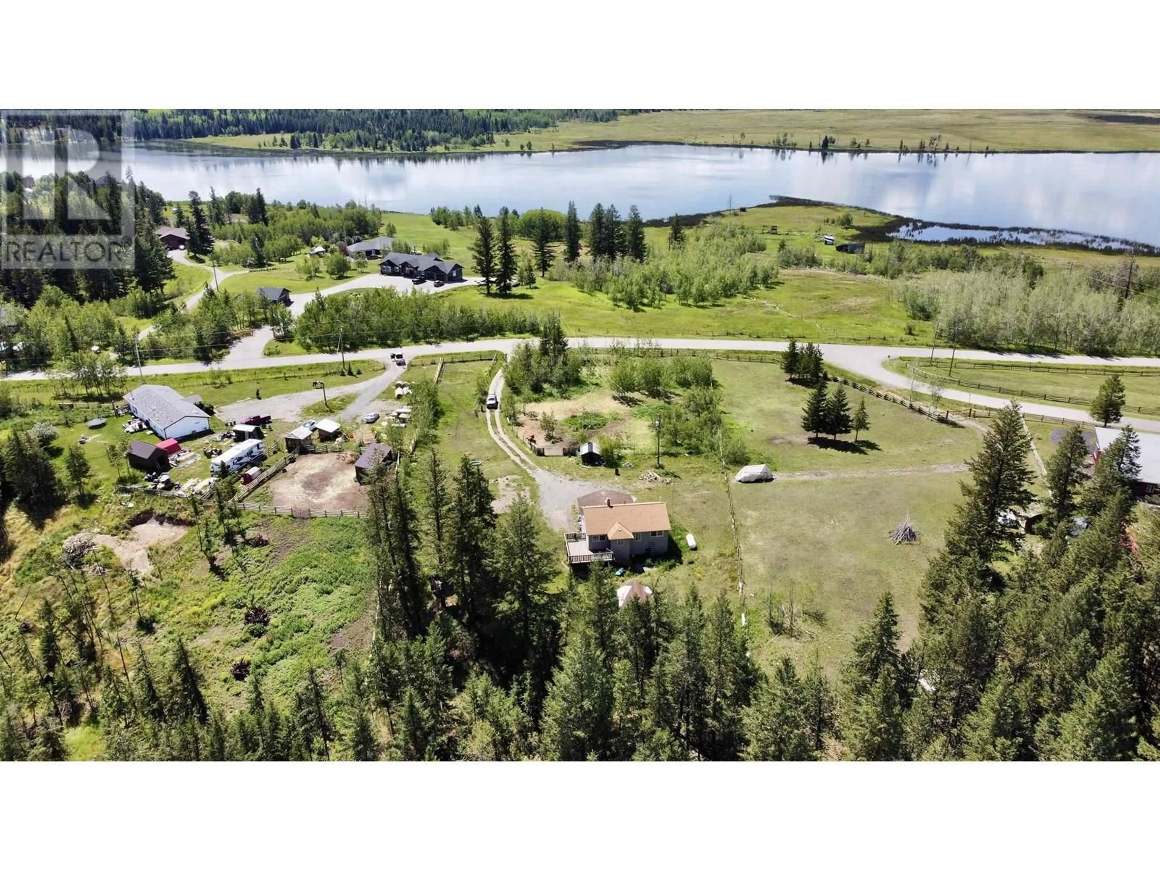 A pic from outside/outdoor area/front of a property/back of a property/a pic from drone, water/lake/river/ocean view for 5437 TATTON STATION ROAD, 100 Mile House British Columbia V0K2E1