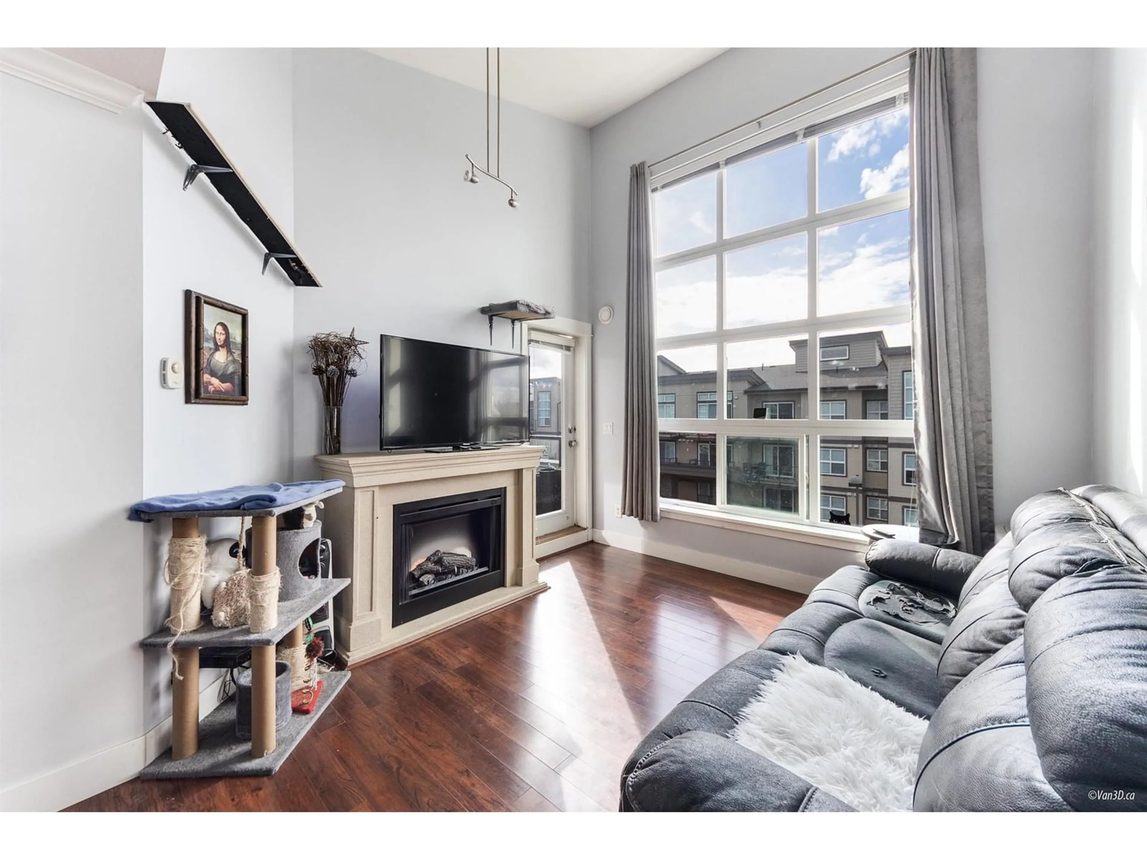 Living room with furniture, wood/laminate floor for 402 - 30525 CARDINAL, Abbotsford British Columbia V2T0A8